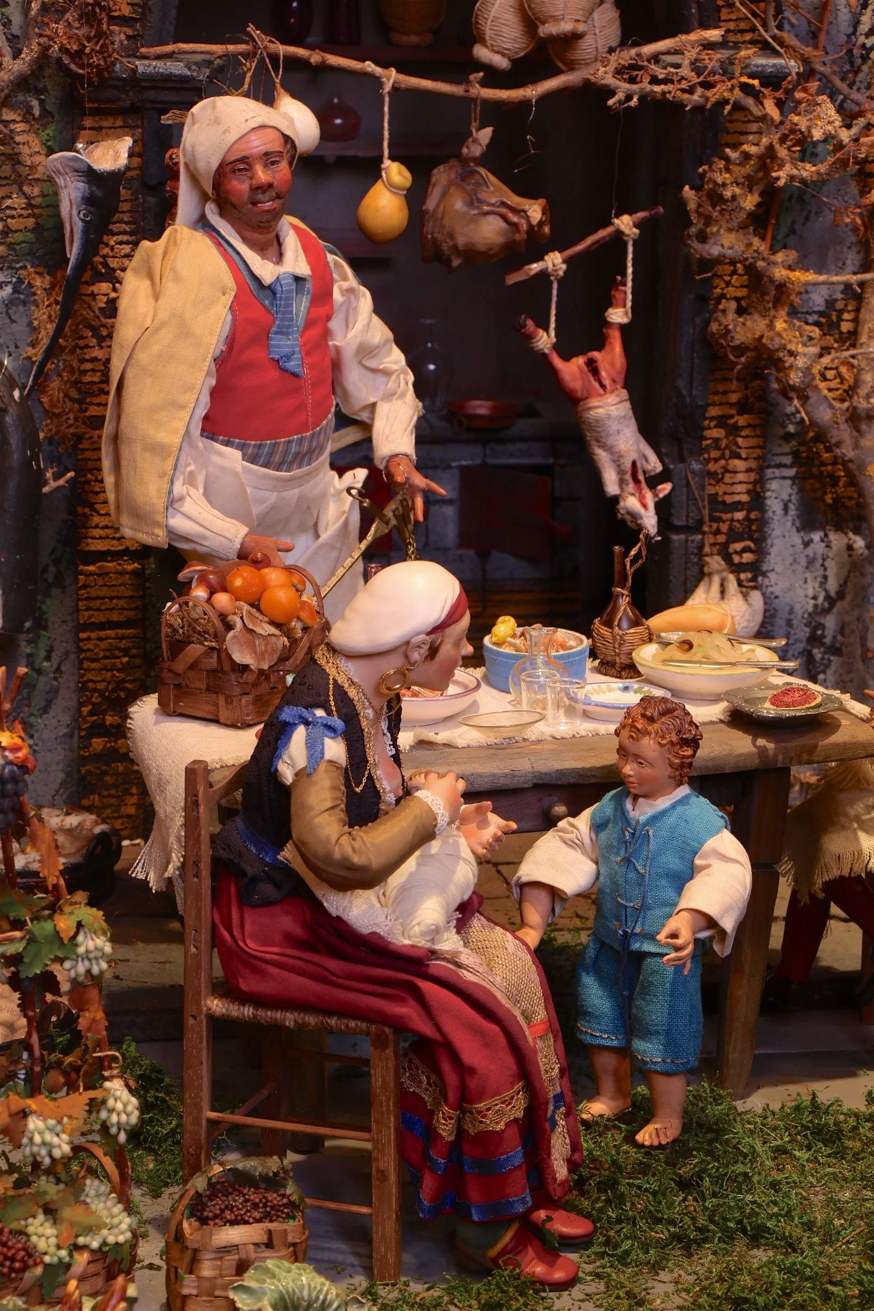 Figure 7: The innkeeper presides over his tavern, while a family sits down at a table for a meal.