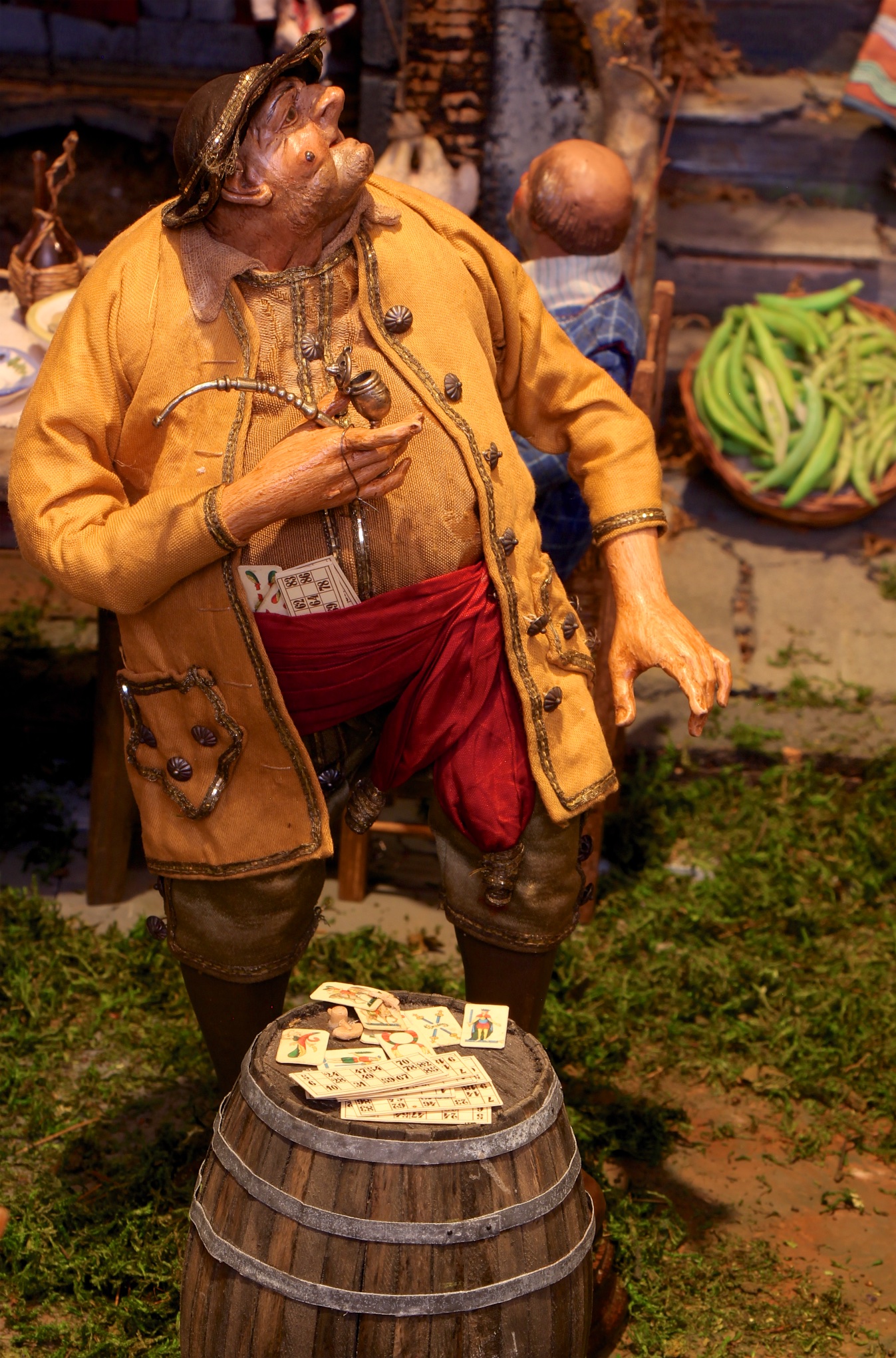 Figure 10: Outside the tavern, a gambler smokes his pipe and tries to lure people into a game. Extra cards are hidden inside his cummerbund.