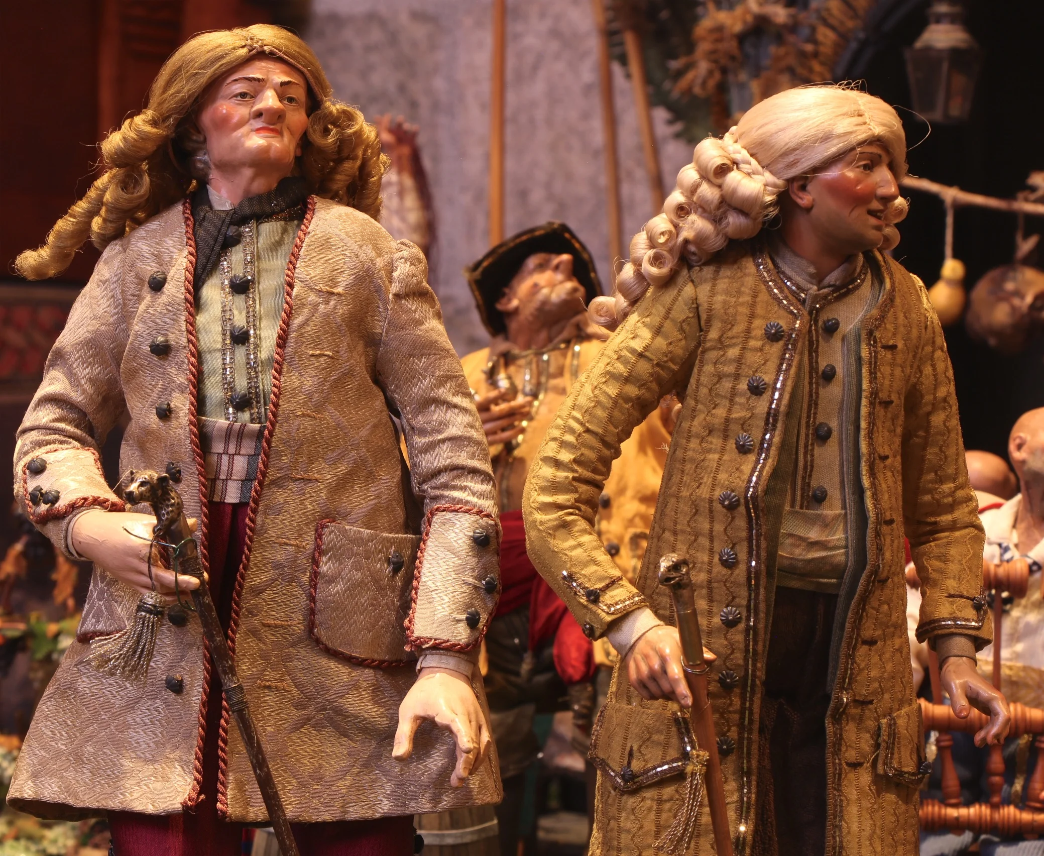 Figure 15: Aristocrats wearing period wigs carry animal-headed walking sticks.
