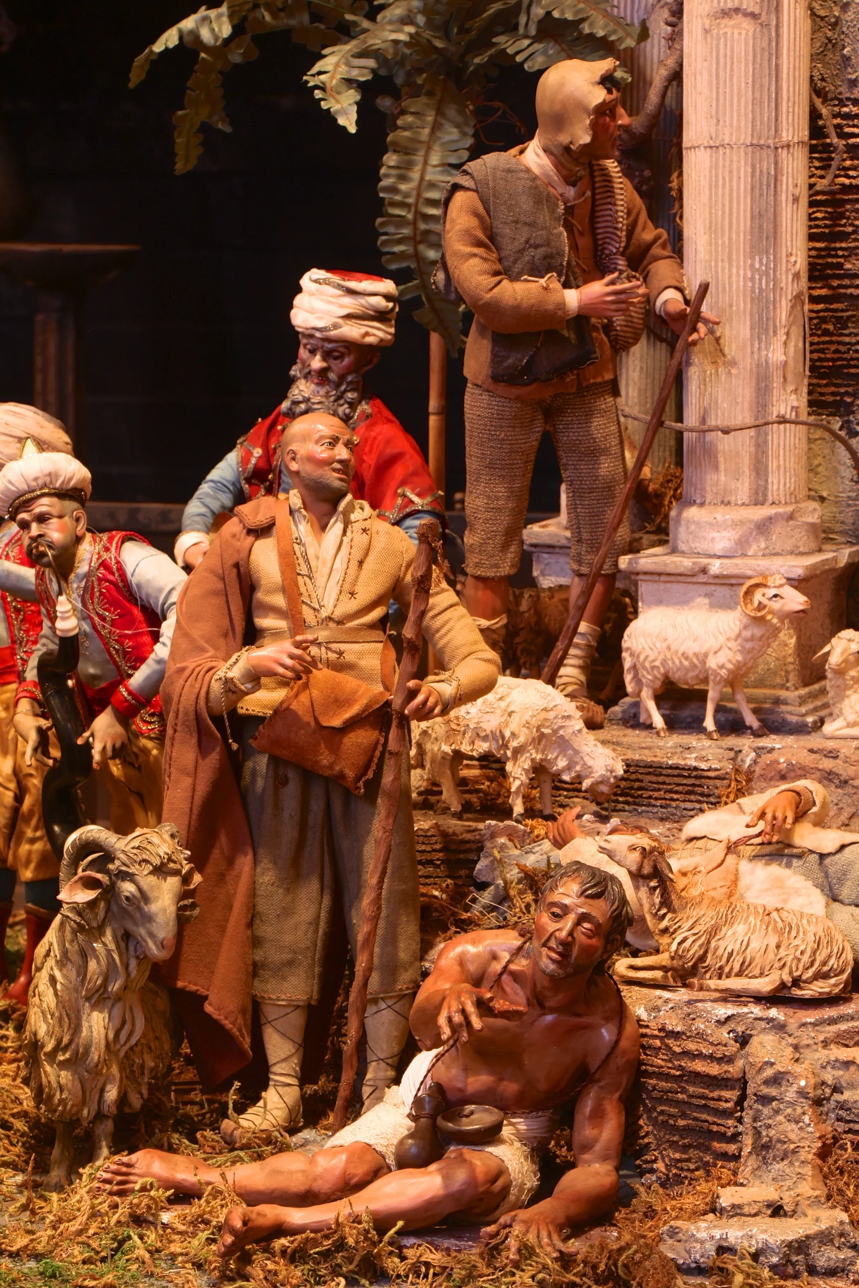 Figure 18: Shepherds arrive at the Nativity scene with their flocks. A mendicant begs on the steps, perhaps a reminder that those who give to the poor will have “treasure in heaven” (Gospel of Mark 10:21).