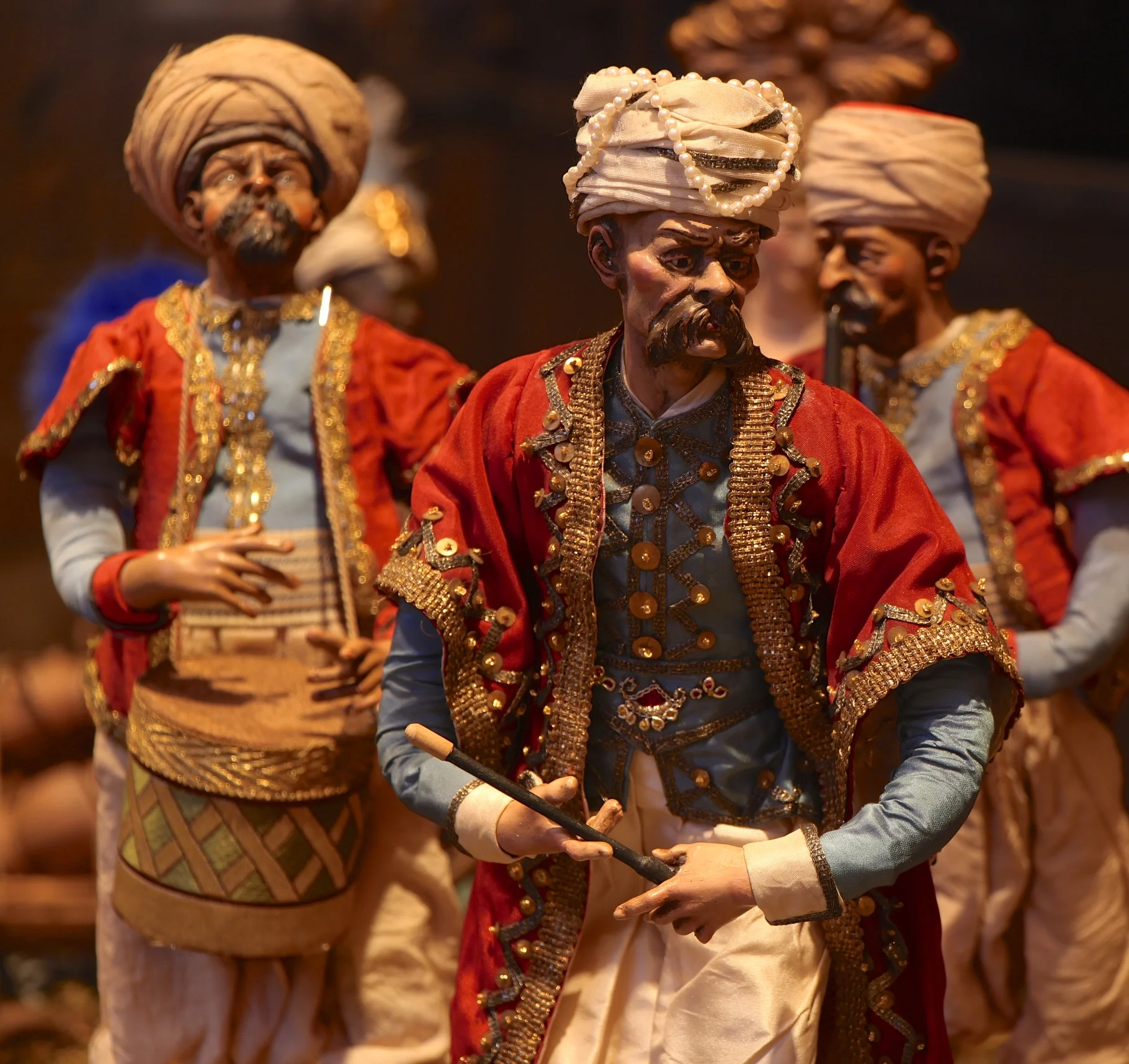 Figure 19: A Turkish band plays in celebration of the miraculous event. Sometimes in Presepi these foreign bands were considered part of the retinue of the wise men, but they were a common sight in 18th-century Naples.