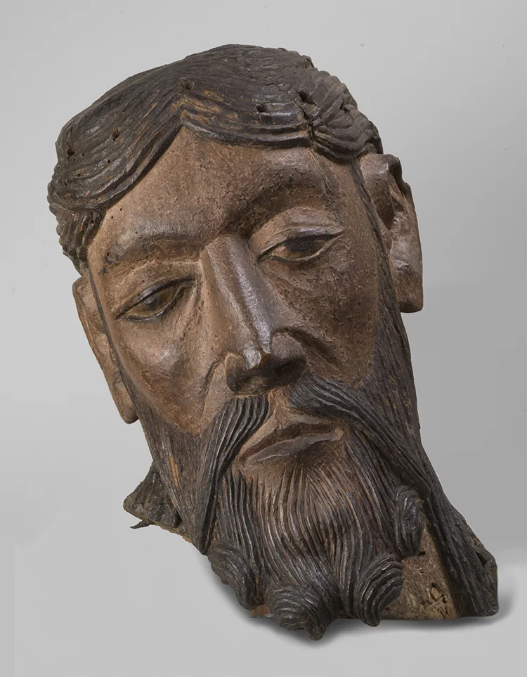 Figure 19: Head from a Figure of the Crucified Christ, possibly made in central France, 1150-1200, wood with polychromy, 18 7/8 x 7 1/16 in., Philadelphia Museum of Art: Gift of Raymond Pitcairn, 1965-216-2.