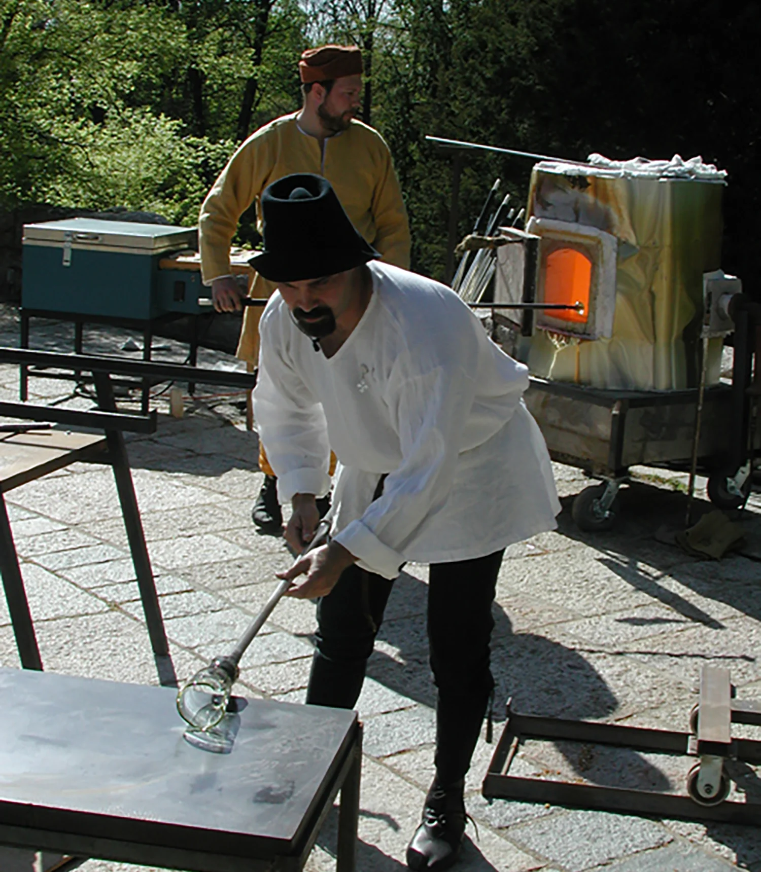 Figure 11: Jason Klein demonstrates the techniques used in the cylinder method of blowing glass. Photograph taken in 2006.