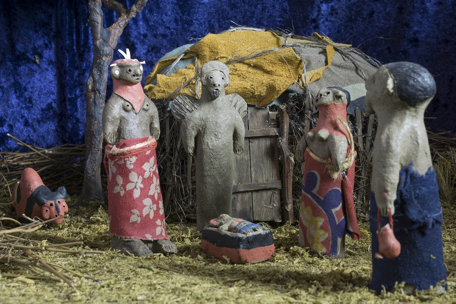 Figure 6: This Nativity was made in Kenya by a member of the Samburu tribe from mud, dung, paint, and cloth. The Samburu are a semi-nomadic ethnic group inhabiting northern Kenya. They share a common language with the Maasai and wear the same form of dress—brightly colored shukas. The figures in this Nativity are dressed in traditional shukas. The Samburu believe in one supreme god, Nkai. Today some Samburu have adopted Christianity. On loan from the Knights of Columbus Museum, New Haven, Connecticut.