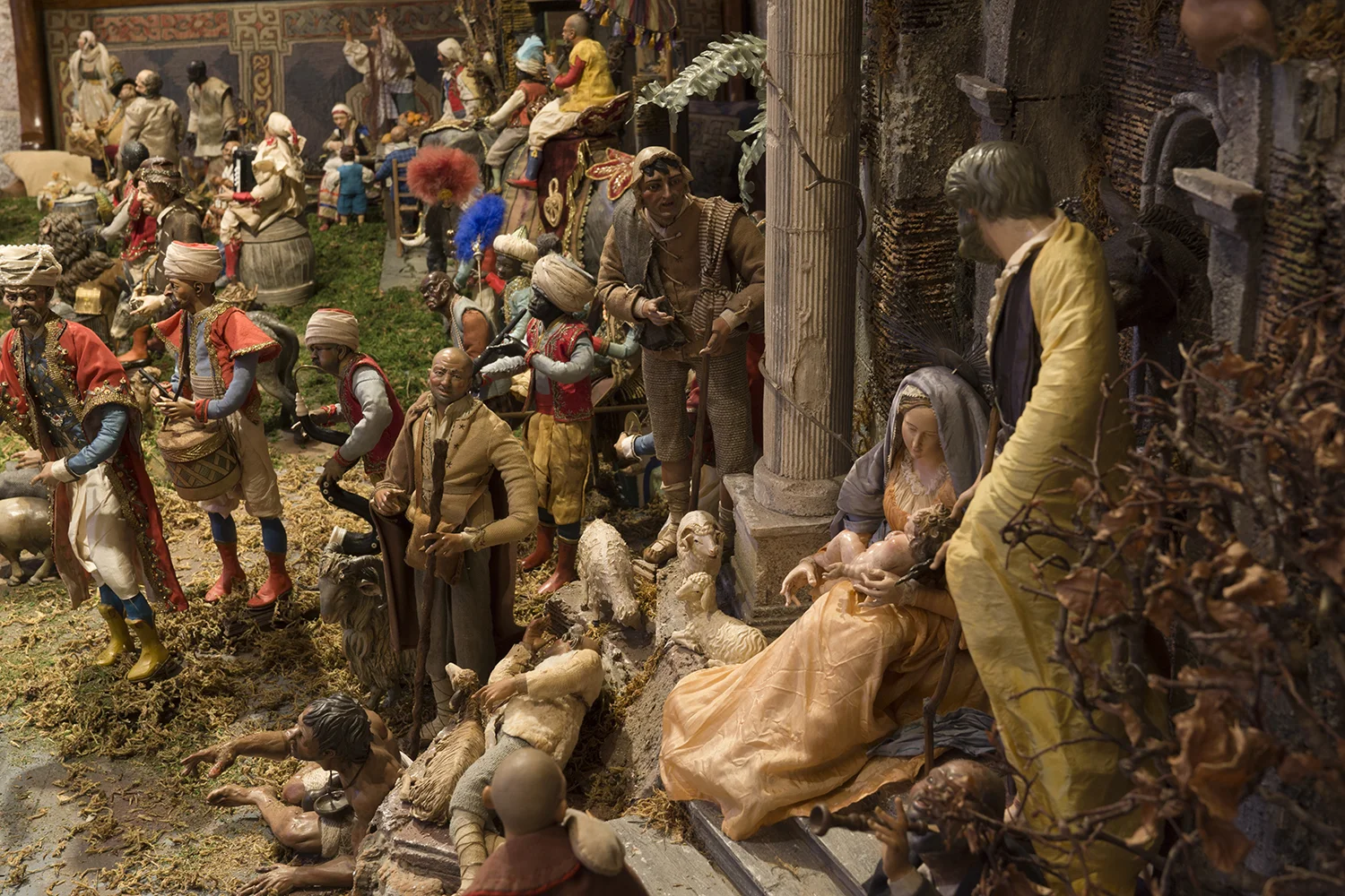 Figure 10: The 100+ figures in this large 19th- and 20th-century Presepio were collected in Italy over a period of more than thirty years by the late Elizabeth Anne Evans of Bucks County, Pennsylvania. A Presepio, which has been called "the translation of the Bible into Neapolitan dialect,” represents daily life in 18th-century Naples, a bustling port city. The miracle of the Nativity is depicted as taking place amid crumbling Roman ruins, signifying the end of paganism and the dawn of Christianity. On loan from the Fleisher Art Memorial, Philadelphia, Pennsylvania.