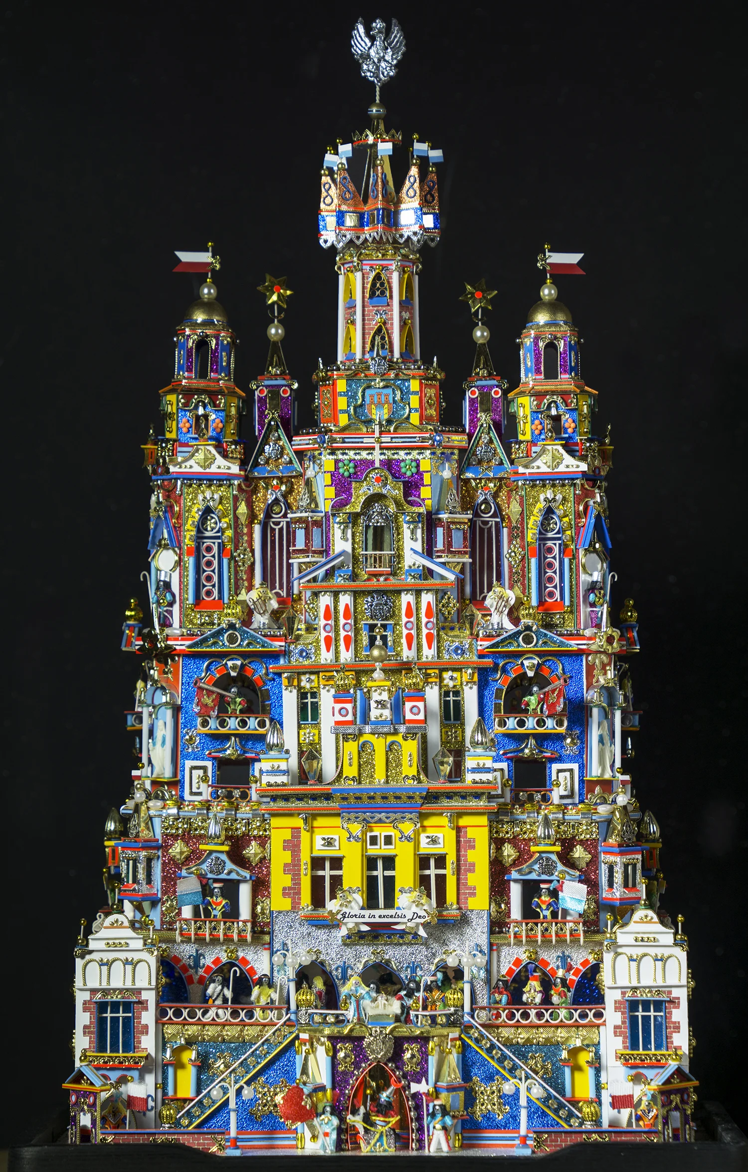 Figure 14: This Nativity, known as a szopka, was made in Poland by Kazimierz Stopinski. The unique folk tradition of the szopka dates to the late 18th and early 19th centuries, with the portable theaters made for Nativity puppet plays. It takes the form of an elaborate building facade in which the tiny figures of the Holy Family are surrounded with fanciful architectural features similar to those seen on Krakow’s historic buildings. Every year since 1937 a szopka-building competition has been held in Krakow’s market square. Stopinski has won first prize three times for his entries (medium and small category), most recently in 2015. On loan from the Knights of Columbus Museum, New Haven, Connecticut.