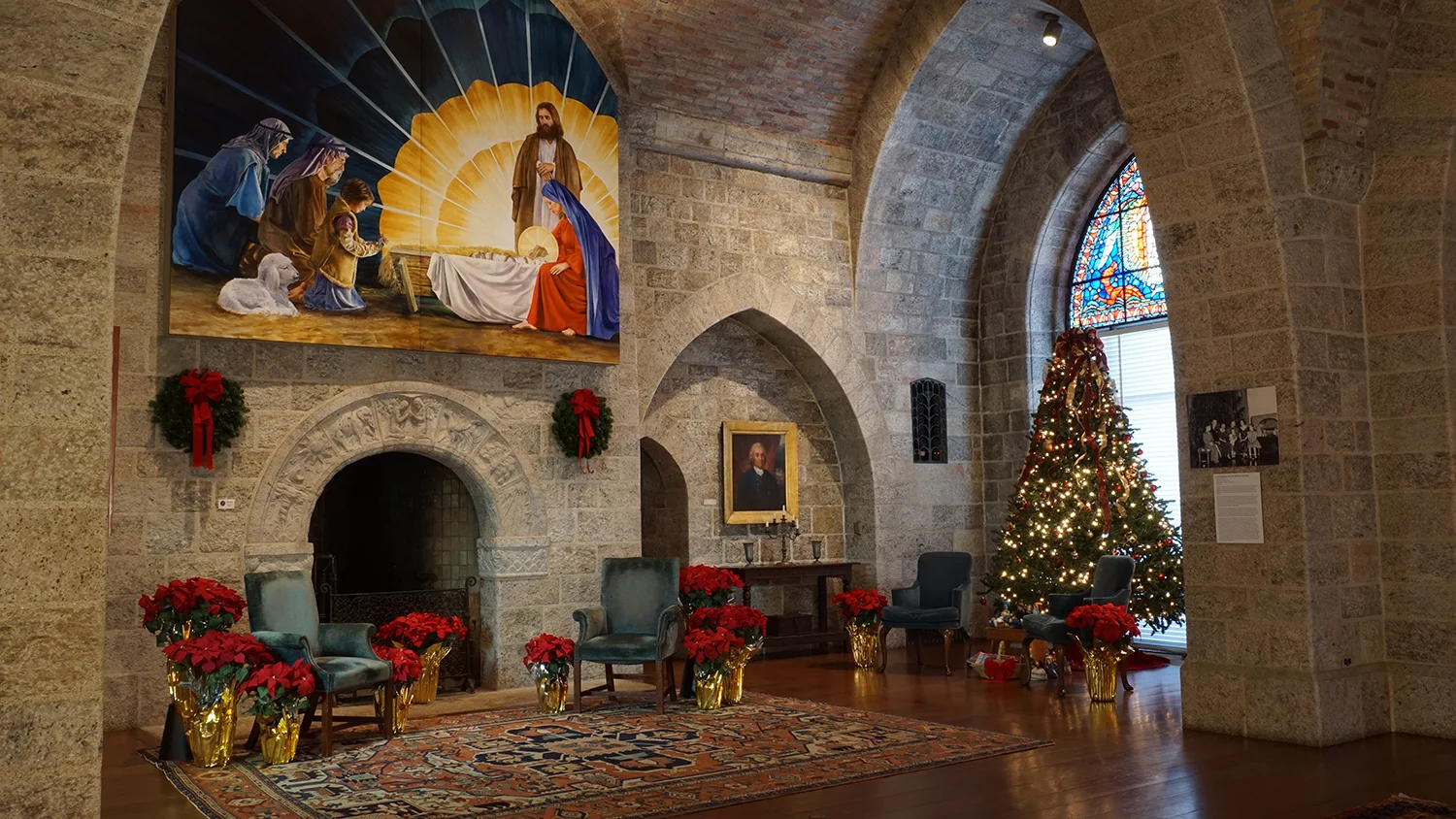 Figure 4: The Upper Hall of Glencairn decorated for Christmas in 2016; the Adoration of the Shepherds hangs above the Days of Creation fireplace. Wreaths and poinsettias, the latter grown in the Pitcairns' greenhouse next door at Cairnwood, were important elements in their Christmas decorating style. 