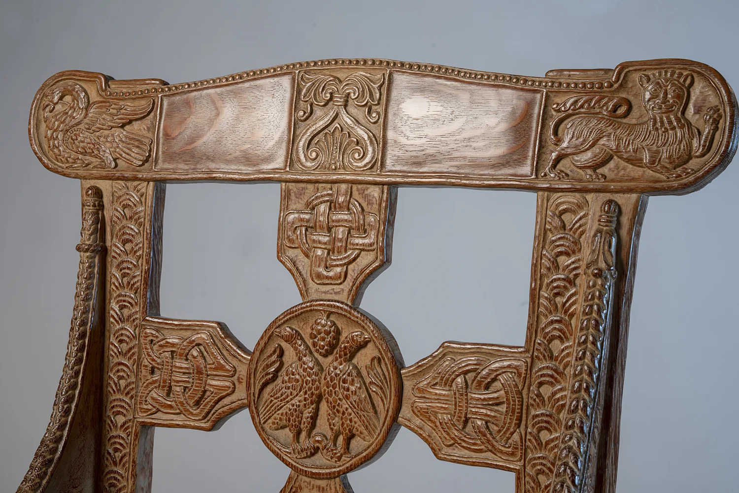 Figure 5: Glencairn's chair back (front side). Like the original Tyldal chair, a square cross is anchored by a central medallion. The upper arm of the cross has a design that was copied directly from the original Norwegian chair.