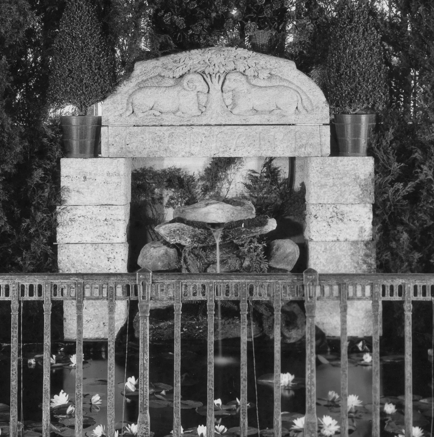 Figure 19: The carved granite lintel for Glencairn's front door ("Glencairn" is engraved in stone under the ram and ewe) was positioned above a naturalistic fountain.