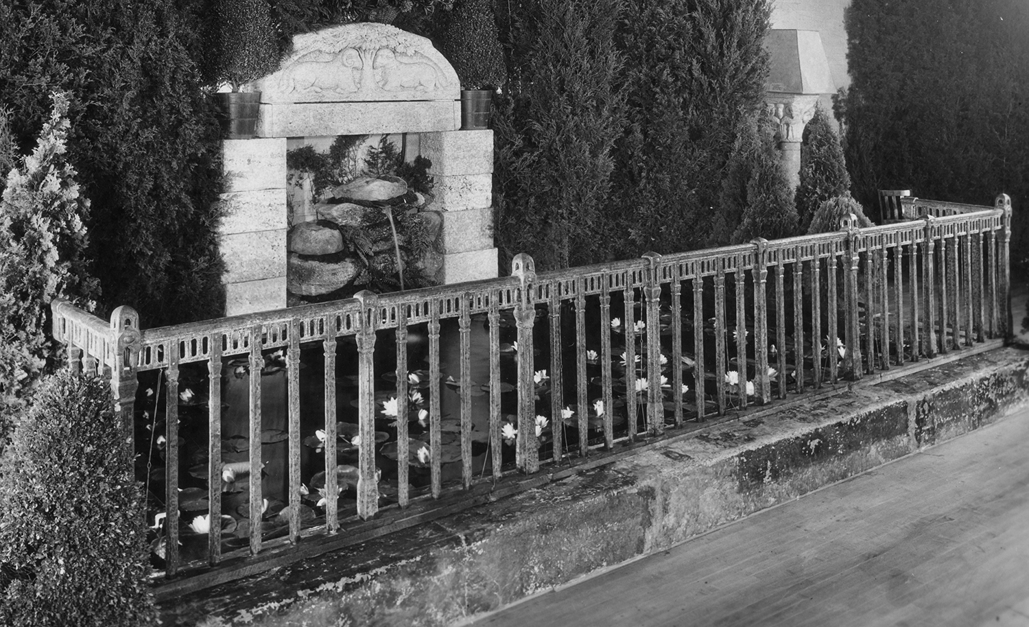 Figure 21: A hand-forged Monel metal railing provided a surround for the lily pond.