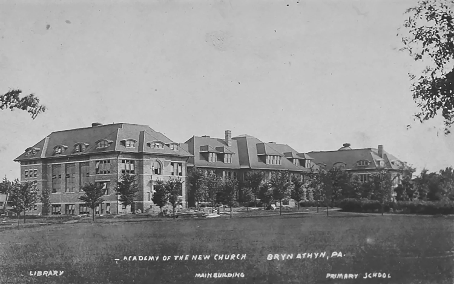Figure 8: This postcard of the Academy of the New Church campus, postmarked October 9, 1919, shows (from left to right) the library and museum, Benade Hall (the classroom building), and De Charms Hall (the elementary school).