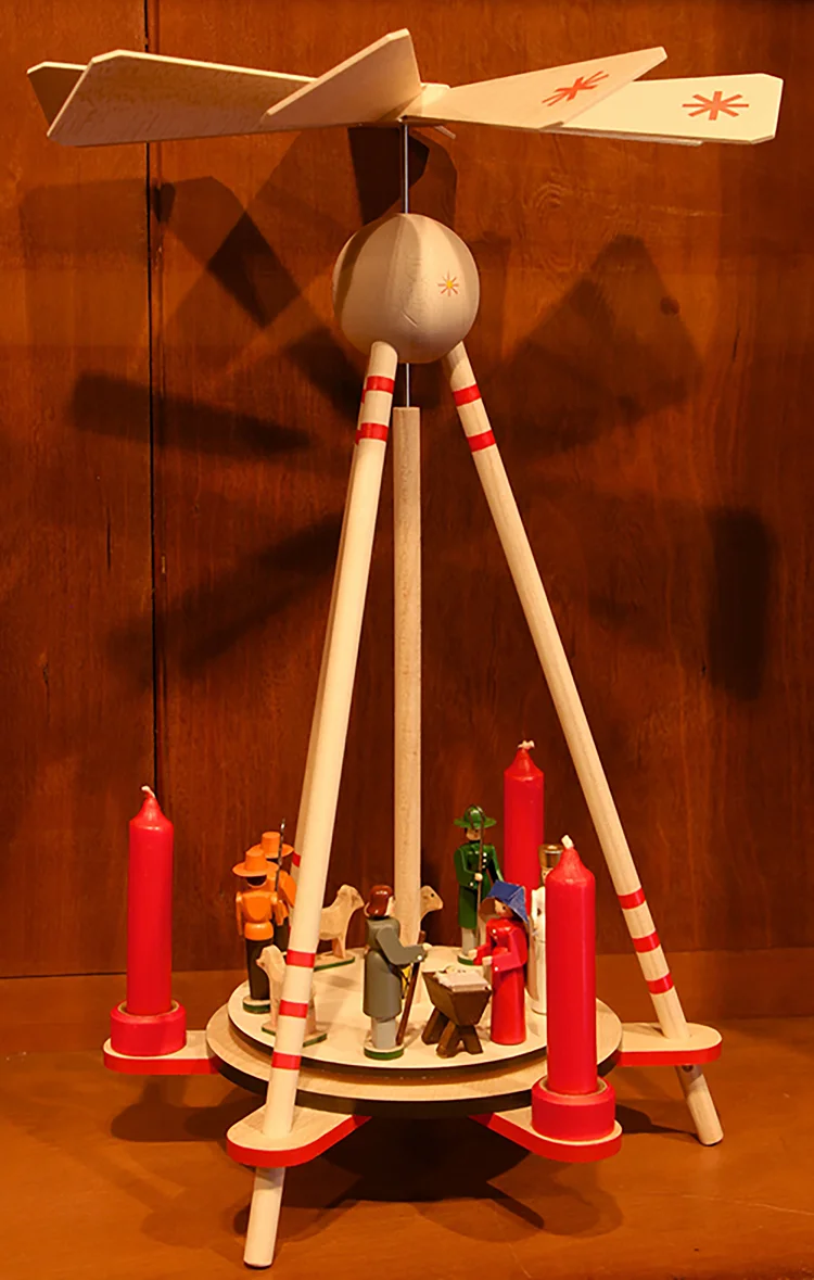 Figure 4: This innovative, fully-collapsible “Christmas pyramid” was recently reissued from the 1940s original by Volker and Heiko Flath, a family of toymakers in the town of Seiffen, Germany. The unassembled pyramid could fit into a small package. They were sent as a Christmas greeting from home to soldiers from Seiffen who were serving in World War II.