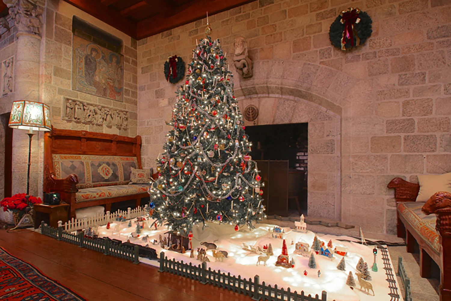 Figure 6: Glencairn’s collection of vintage Christmas tree ornaments and Christmas village decorations was gifted in 2011 by Brother Bob Reinke, a Franciscan Friar who is a pastoral associate at St. Ann’s Church in Hoboken, New Jersey. Brother Bob, whose special love of Christmas has earned him the nickname “Brother Christmas,” joined the Brothers of the Poor of St. Francis in 1958. St. Francis is credited with popularizing the tradition of the Nativity scene, famously staging a live Nativity in the woods near Assisi, Italy, in 1223. The 1950s Lionel steam locomotive and rolling stock were donated by Louise Chardos and her brothers.