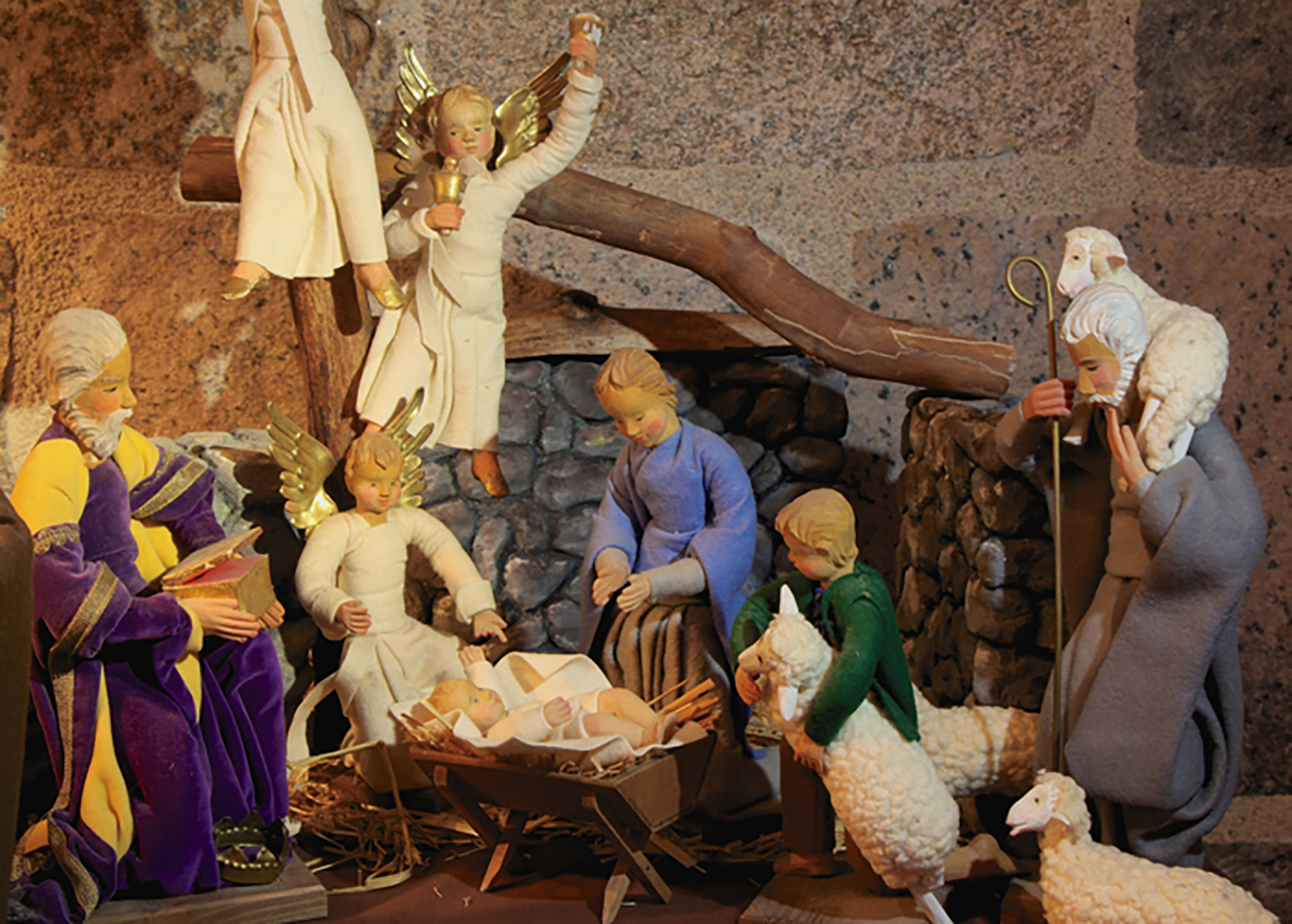 Figure 7: These Nativity figures were made by the artist Anna Fehrle (1892–1981). The heads, hands and feet of each figure were carved from wood and then painted. Fehrle used fabric-wrapped wire to form and pose the bodies. She also clothed them and made the additional equipment. Anna Fehrle was born in the town of Schwäbisch Gmünd, Germany, in 1892. Her brother was the well-known sculptor Jakob Wilhelm Fehrle. Jakob is credited with encouraging Anna to pursue wood carving. Anna established her own workshop, and exhibited regularly at the fairs in Leipzig and Frankfurt. She was known for her Nativities, dolls, and angels. On loan from the National Christmas Center and Museum.