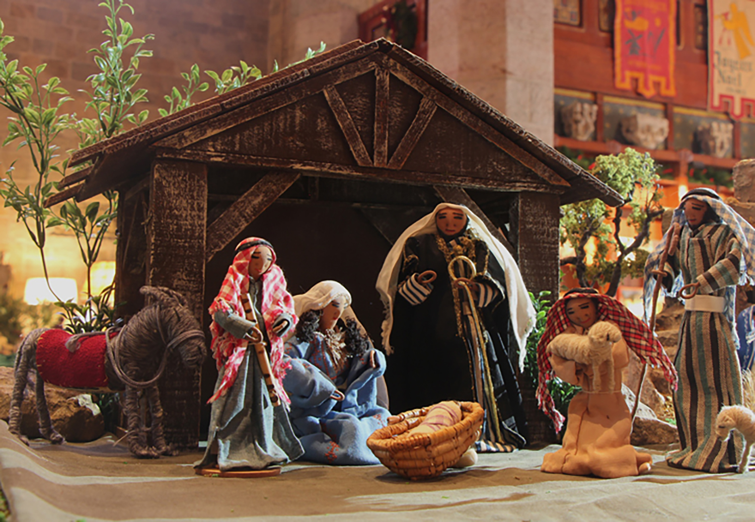 Figure 10: This Nativity was made in 1960 by Palestinian women in the Aqabat Jaber Refugee Camp. The figures are all hand made and dressed in traditional Palestinian clothing. The sheep and donkey were created by wrapping wire frames with yarn. The pieces have printed labels on the bottom: “World Y.W.C.A. Centre, Aqabat Jaber Refugee Camp, Jericho – Jordan.” The vision of the World Young Women’s Christian Association is “a fully inclusive world where justice, peace, health, human dignity, freedom and care for the environment are promoted and sustained by women’s leadership.”