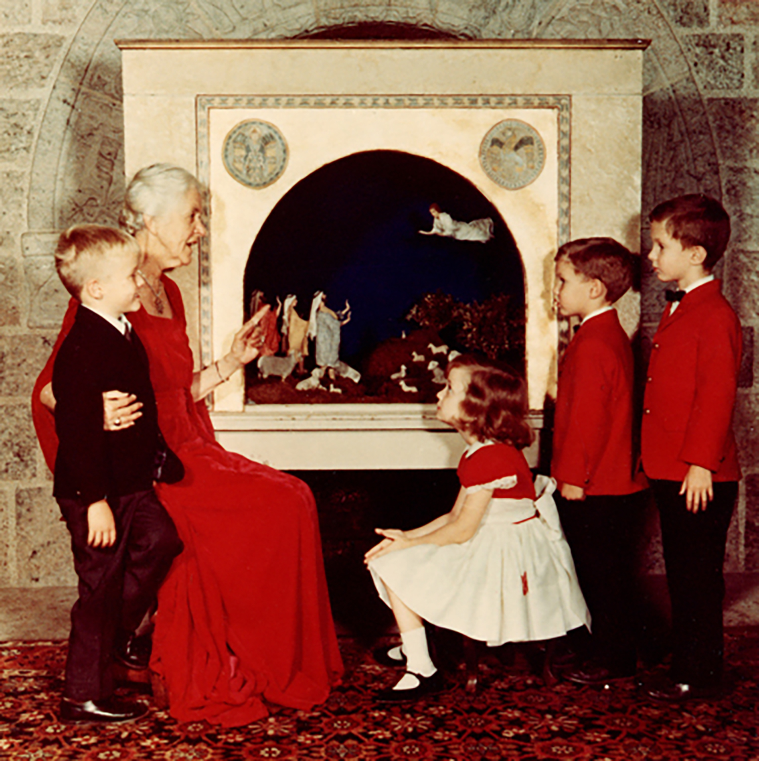 Figure 2: Mildred Pitcairn at Glencairn with her grandchildren in 1967, in front of the Nativity made for the Pitcairn family in the 1920s by Winfred S. Hyatt.