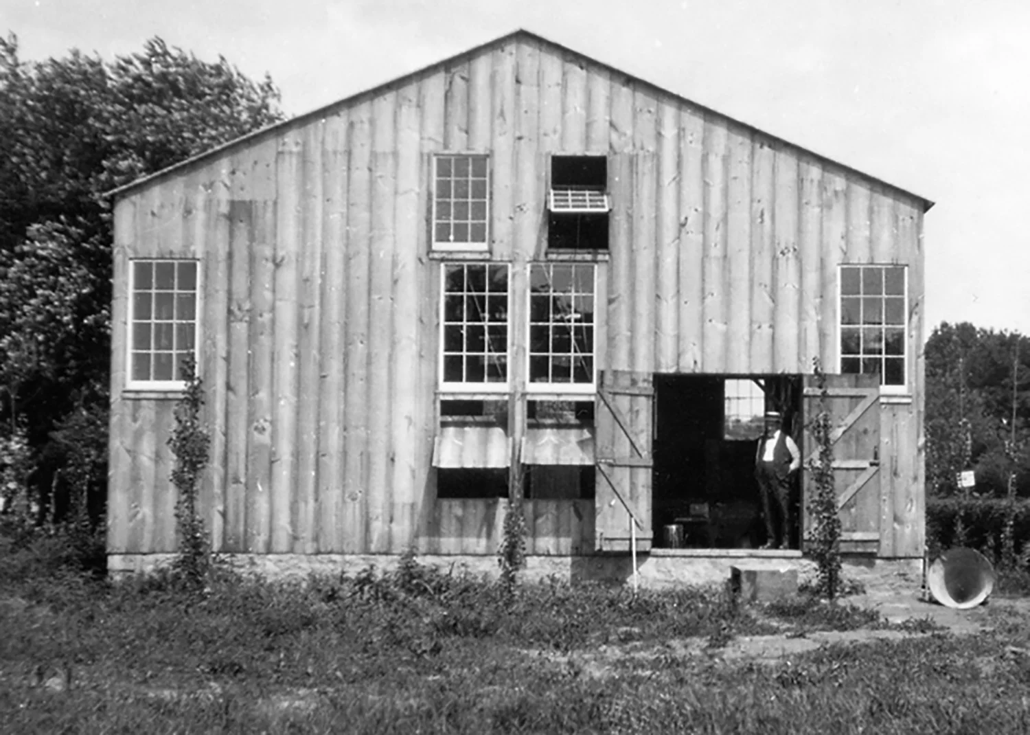 Figure 8: David Smith, glassblower, stands in the doorway of the Bryn Athyn glass factory.