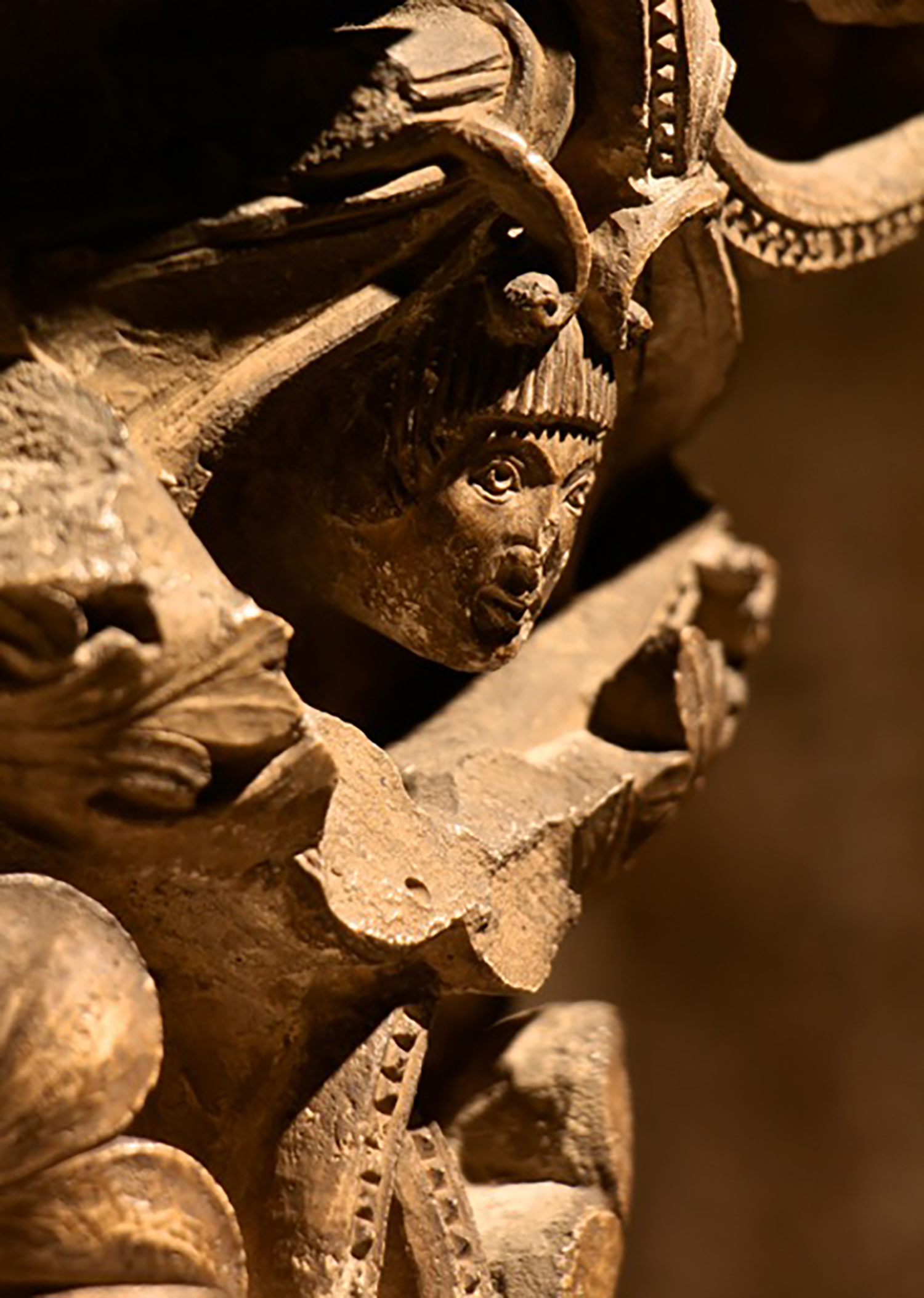 Figure 6: A youthful face peeks out, his arched eyebrows and penetrating stare seeking the viewer’s own gaze.