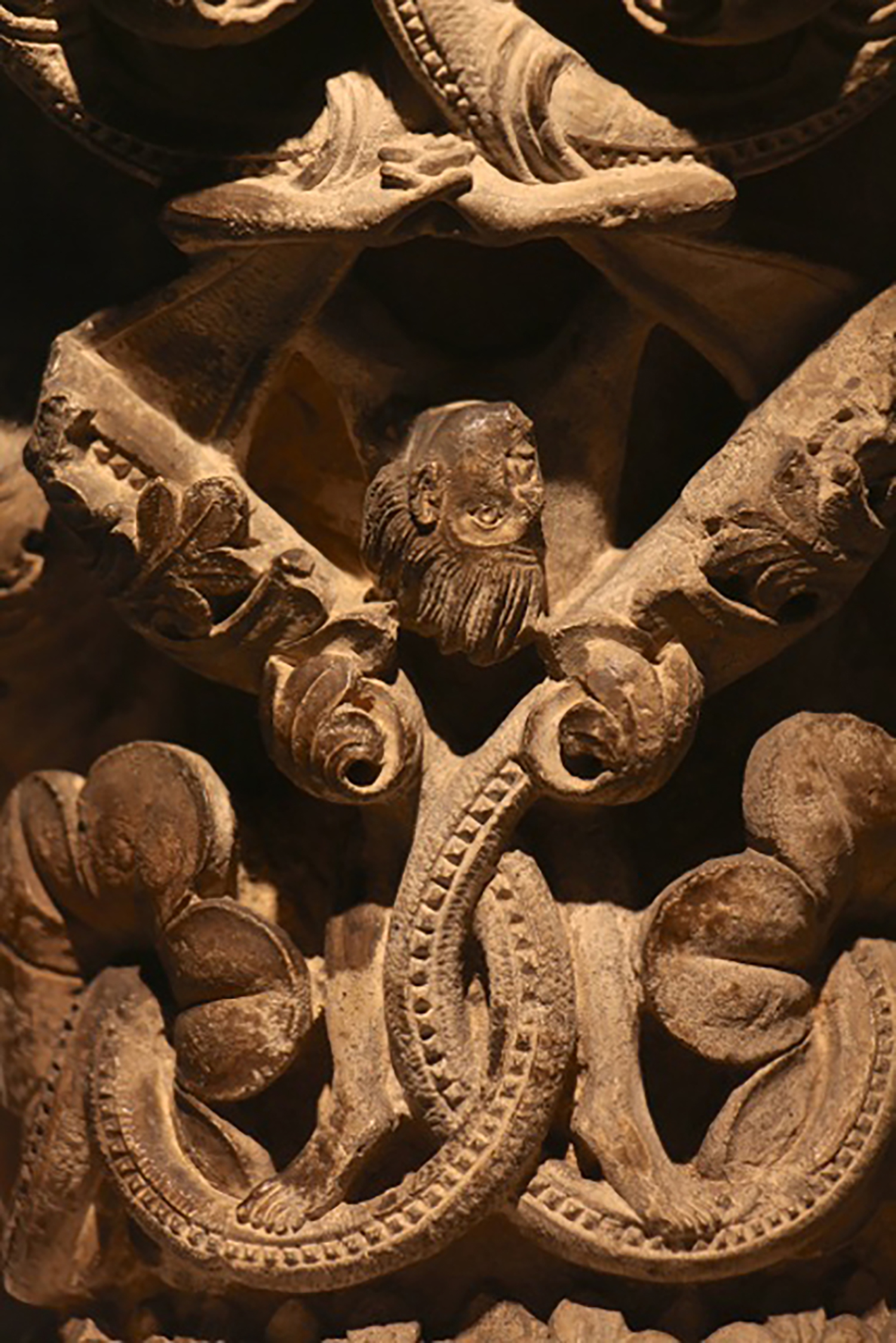 Figure 8: An acrobatic figure hangs upside down from the vines above, his short hair streaming downward from the pull of gravity.