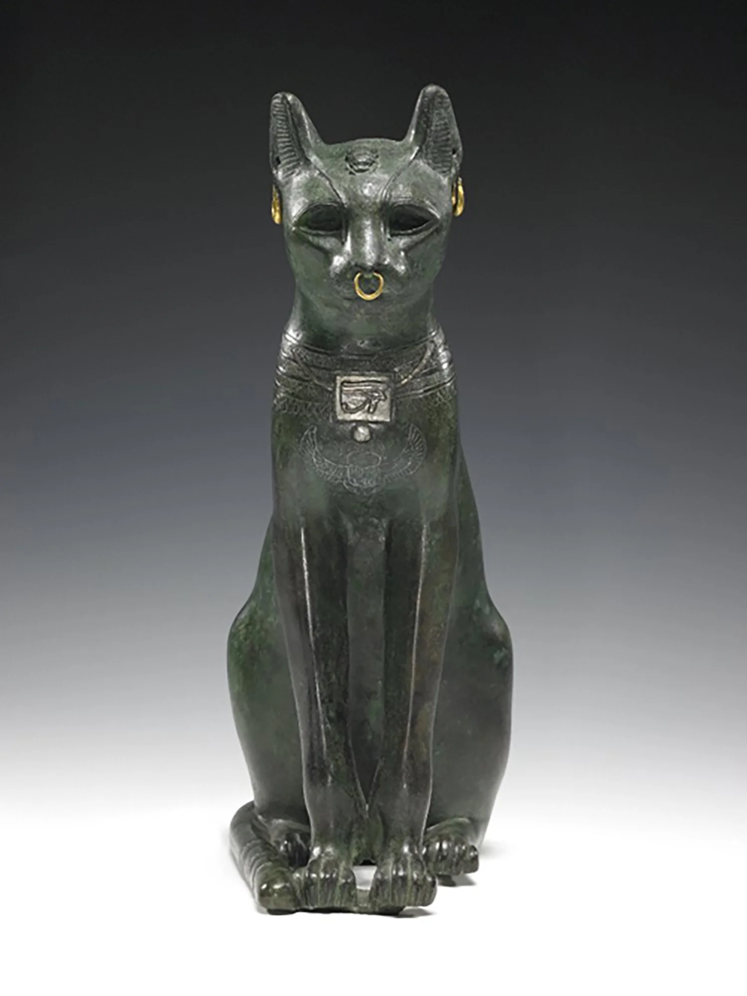Figure 14: The bronze hollow-cast Gayer-Anderson cat figure with details in silver and gold, Late Period (664-332 BCE). British Museum EA64391. Image courstesy of the British Museum.