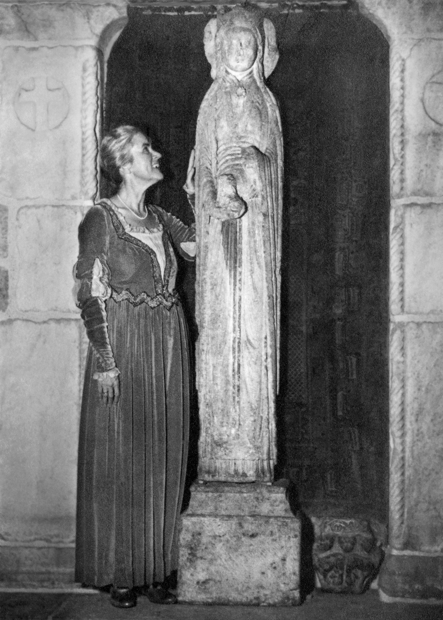 Figure 9: Mildred Pitcairn, wife of Raymond, poses in a medieval-style gown with the “Slim Princess.” Photo: Glencairn Museum Archives.