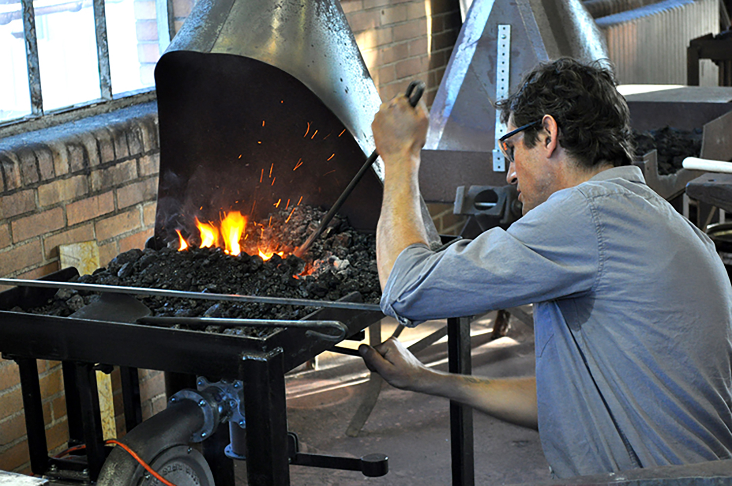 Warren Holzman working in the metalwork studio at Bryn Athyn College.