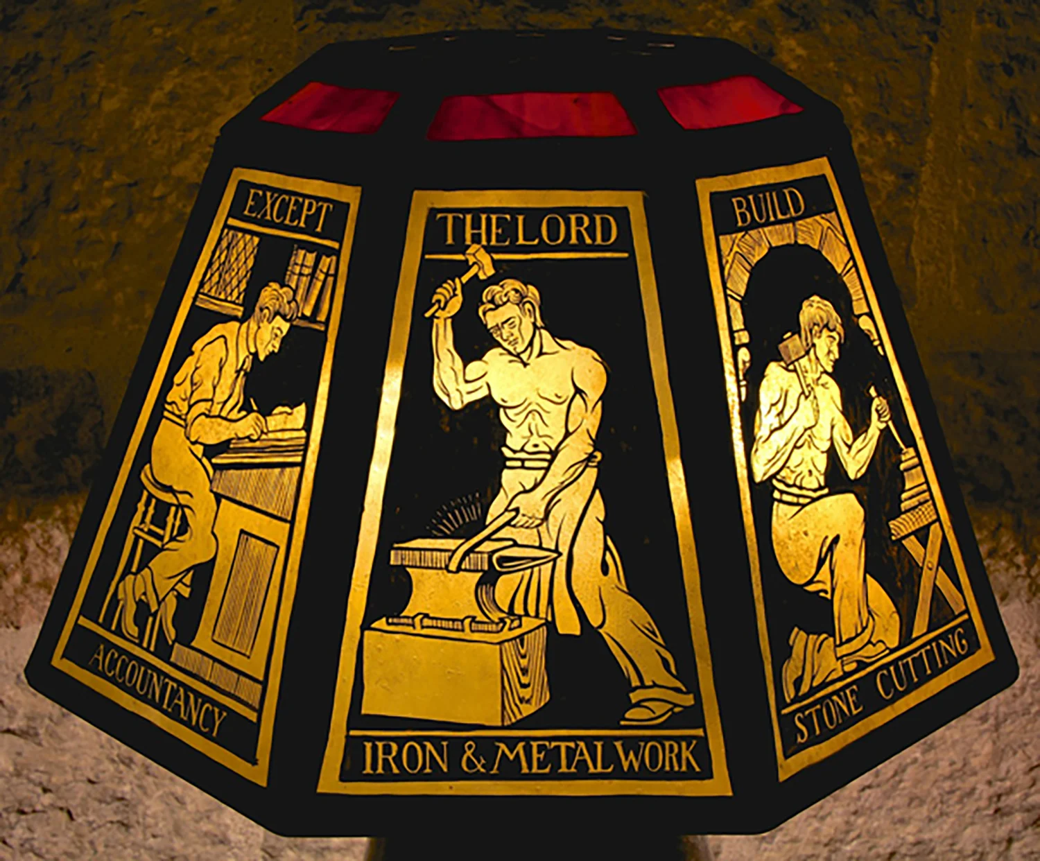 Figure 24: This lamp with an eight-sided, painted glass shade depicting the various crafts and departments needed in the construction of Glencairn, was given to Raymond and Mildred Pitcairn as a Christmas gift in 1941. It was made by the craftsmen who worked for them. One of the sides is titled, “iron and metalwork.” Around the top is a biblical quotation: “Except the Lord build the house, they labor in vain that build it” (Psalm 127:1).