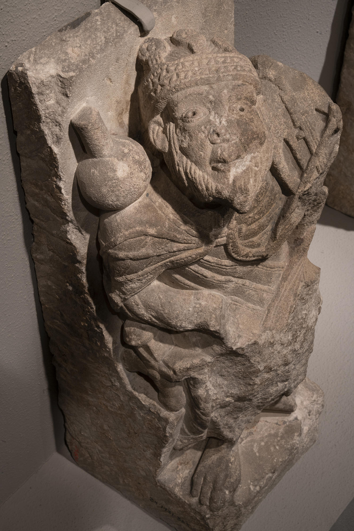 Figure 3: Elder of the Apocalypse, limestone voussoir from a church in Aquitaine, France, c. 1125-50 (09.SP.262a).