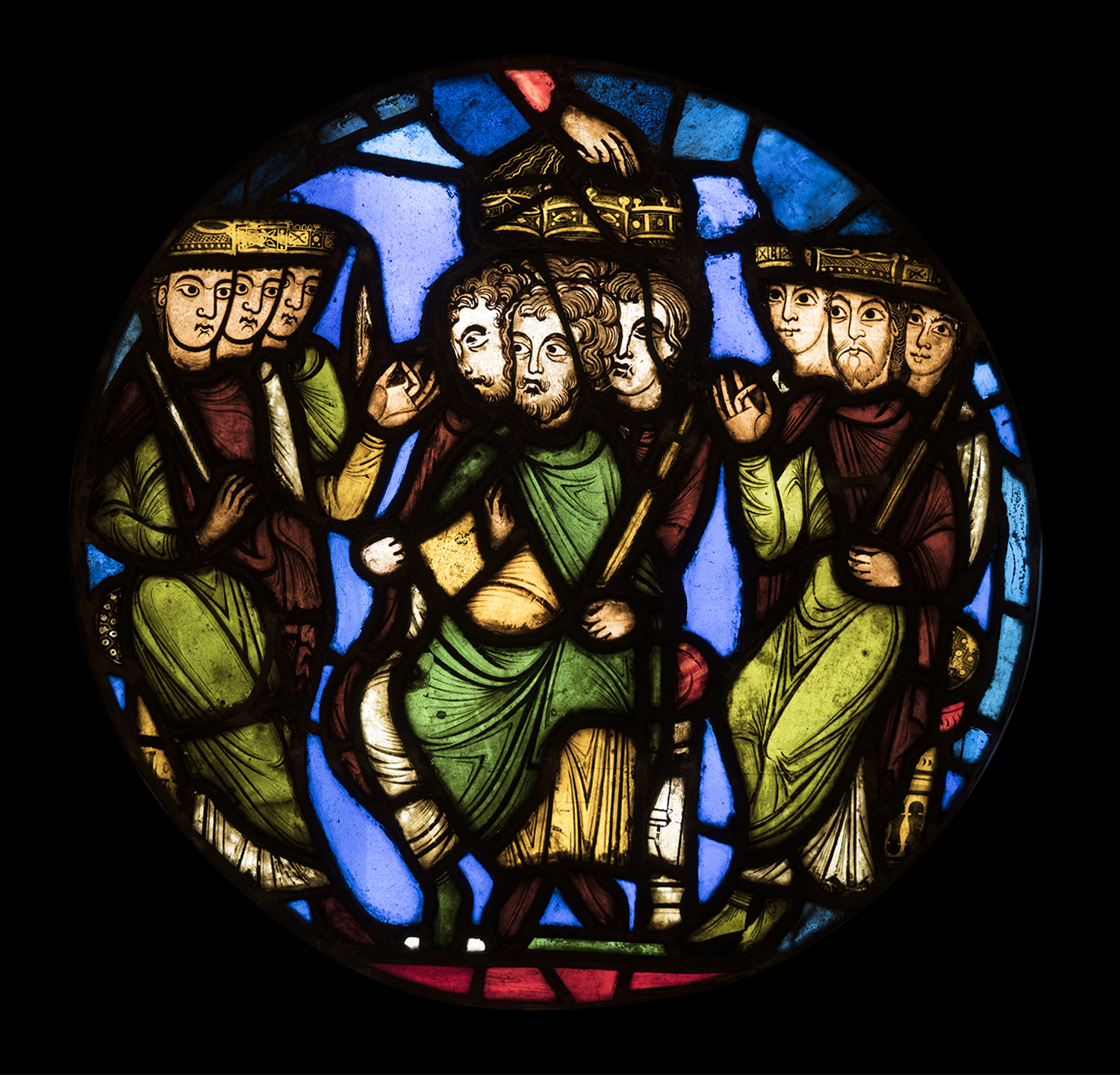 Figure 9: A Coronation Scene, stained-glass panel from the Royal Abbey Church of Saint-Denis, outside Paris, France, c. 1150. The Hand of God in the center crowns three kings (03.SG.111).