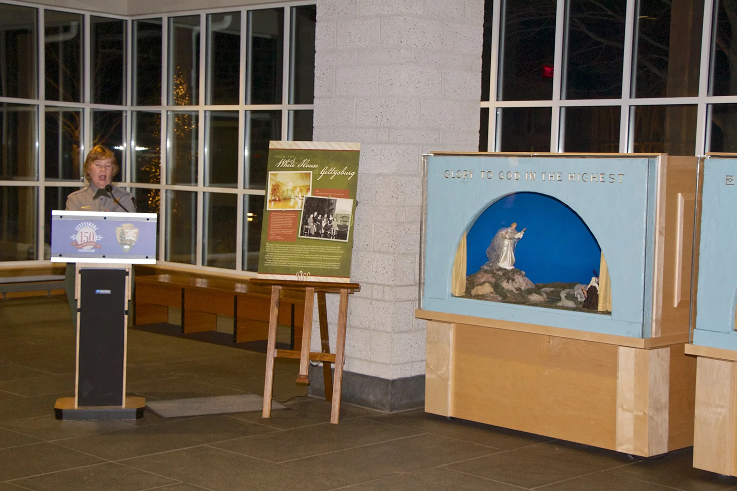 Figure 8: Carol Hegeman, supervisory historian at the Eisenhower National Historic Site, speaking at a celebration of the installation of the White House Nativity scenes at the Museum and Visitor Center in Gettysburg. According to Hegeman, “These Nativity scenes were so important to the Eisenhowers that after being displayed in the White House from 1954 to 1960, Mamie gave them to a local church, the Gettysburg Presbyterian Church, for continued display and enjoyment. We are pleased that we can continue that tradition of displaying them each holiday season.” Photo: Ed Gyllenhaal.