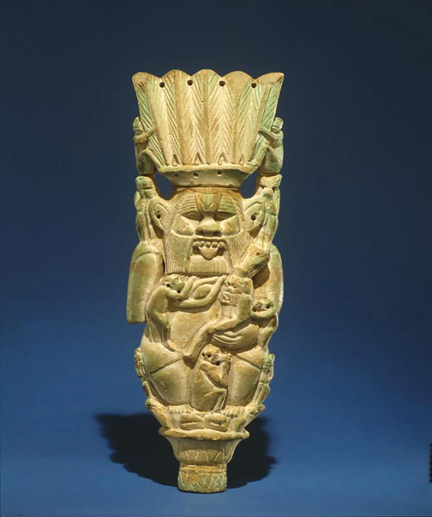 Figure 11: Faience plaque of the god Bes. Dynasty 21-25 (1075-656 BCE). University of Pennsylvania Museum E14358.