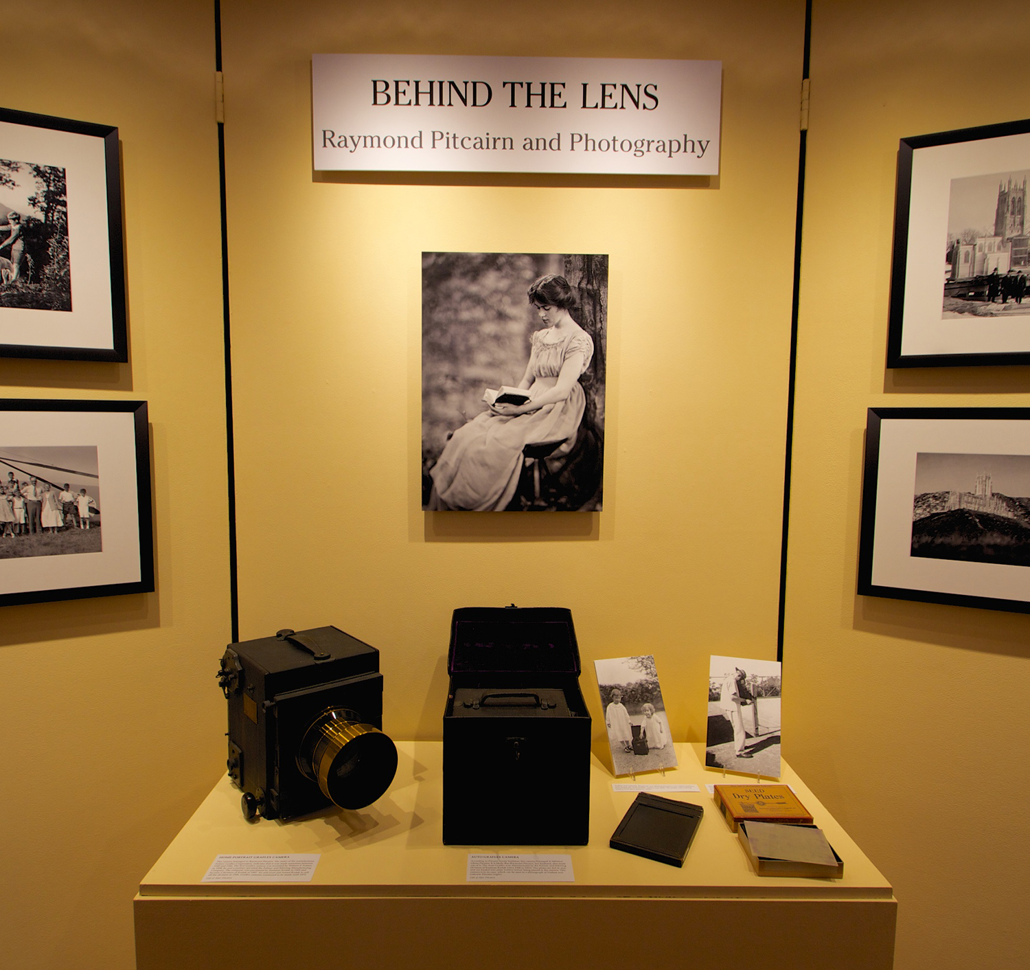 Central exhibition panel for Behind the Lens: Raymond Pitcairn and Photography .