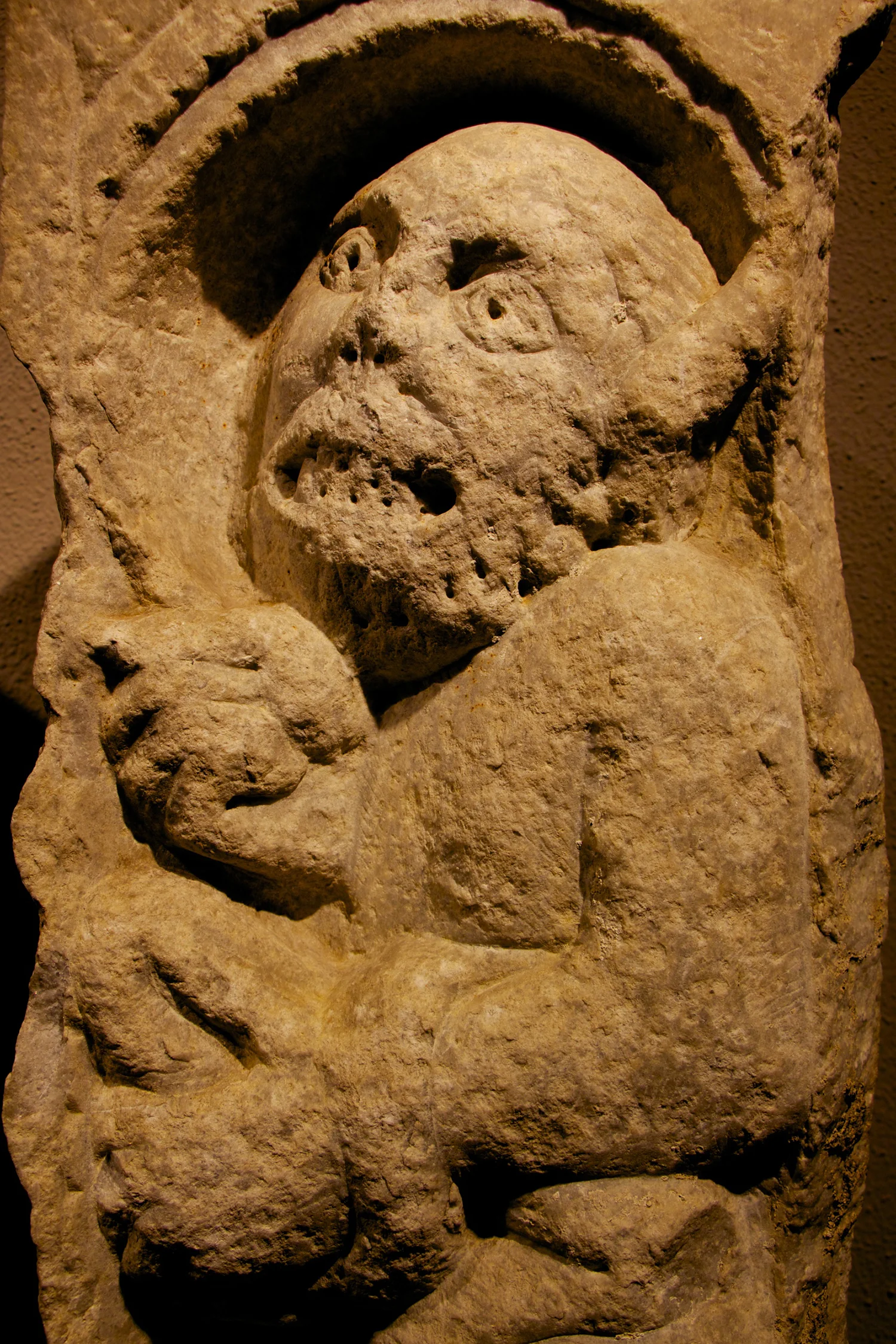 Figure 3: The devil holds a stone in his left hand with his tail draped over his arm.