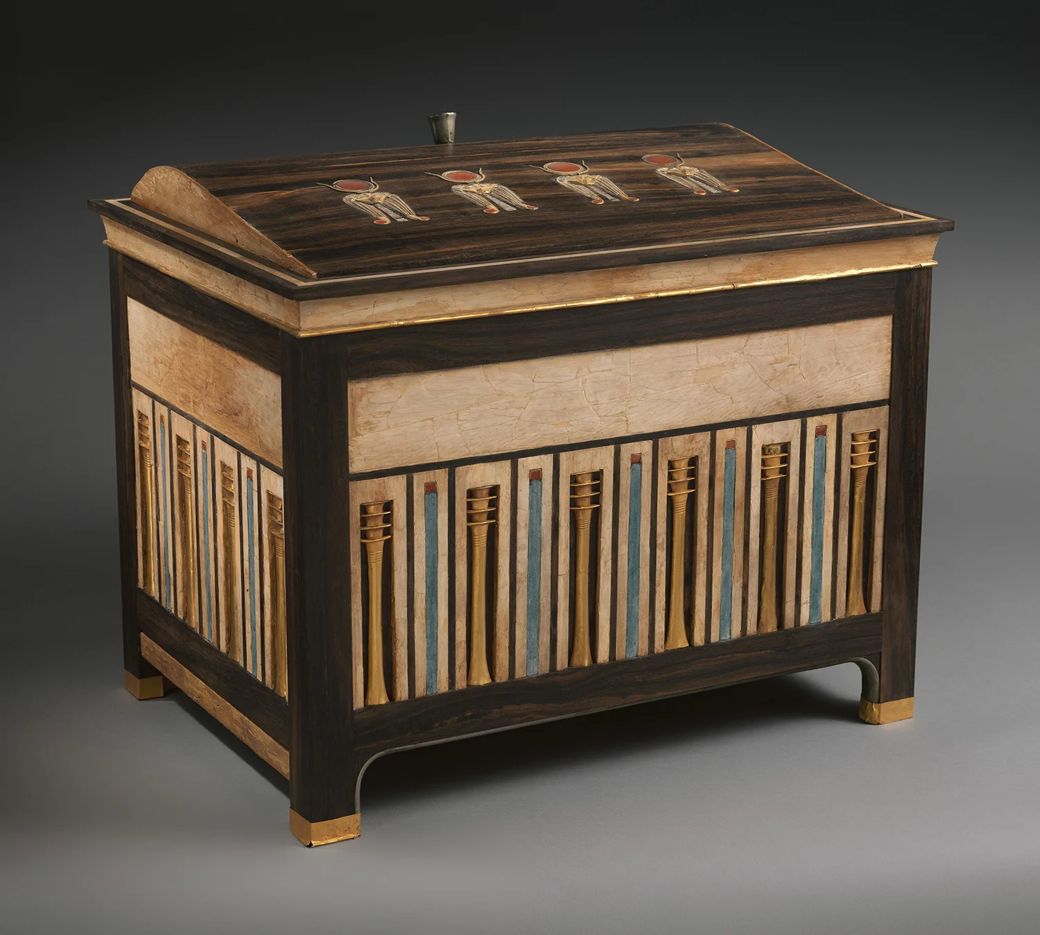 Figure 7: Jewelry Chest of Sithathoryunet, Purchase, Rogers Fund and Henry Walters Gift, 1916, Metropolitan Museum of Art, 16.1.1. Image courtesy of The Metropolitan Museum of Art, NYC. This wooden jewelry chest combines Hathoric imagery on its lid and elongated djed pillars along the sides. These decorations, while aesthetically pleasing, also had deeper religious meaning.