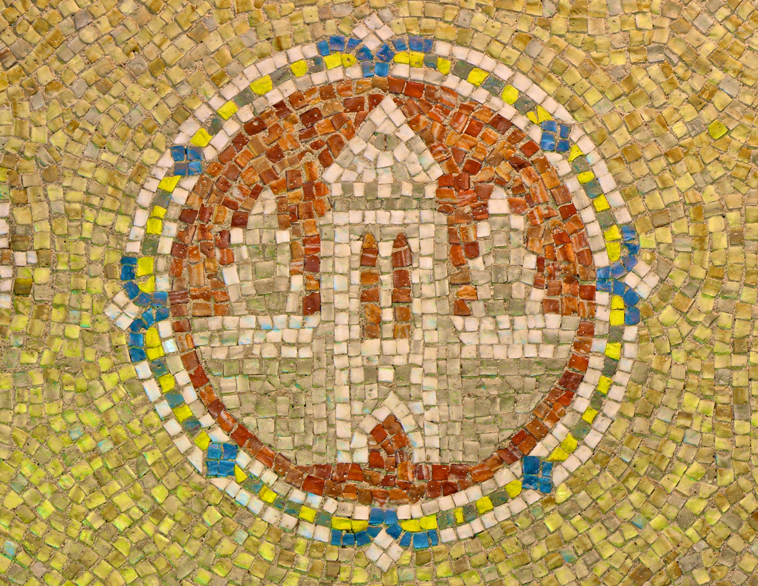 Figure 1: Mosaic medallion on the wall of the first floor entryway area.