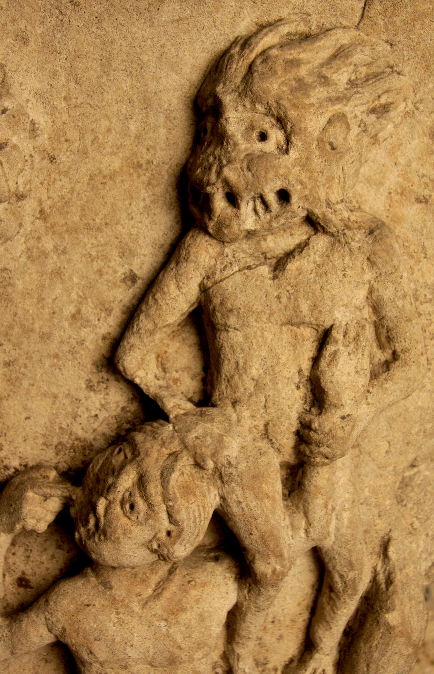 Figure 8: A grotesque demon yanks at Dives hair and tugs his arm.