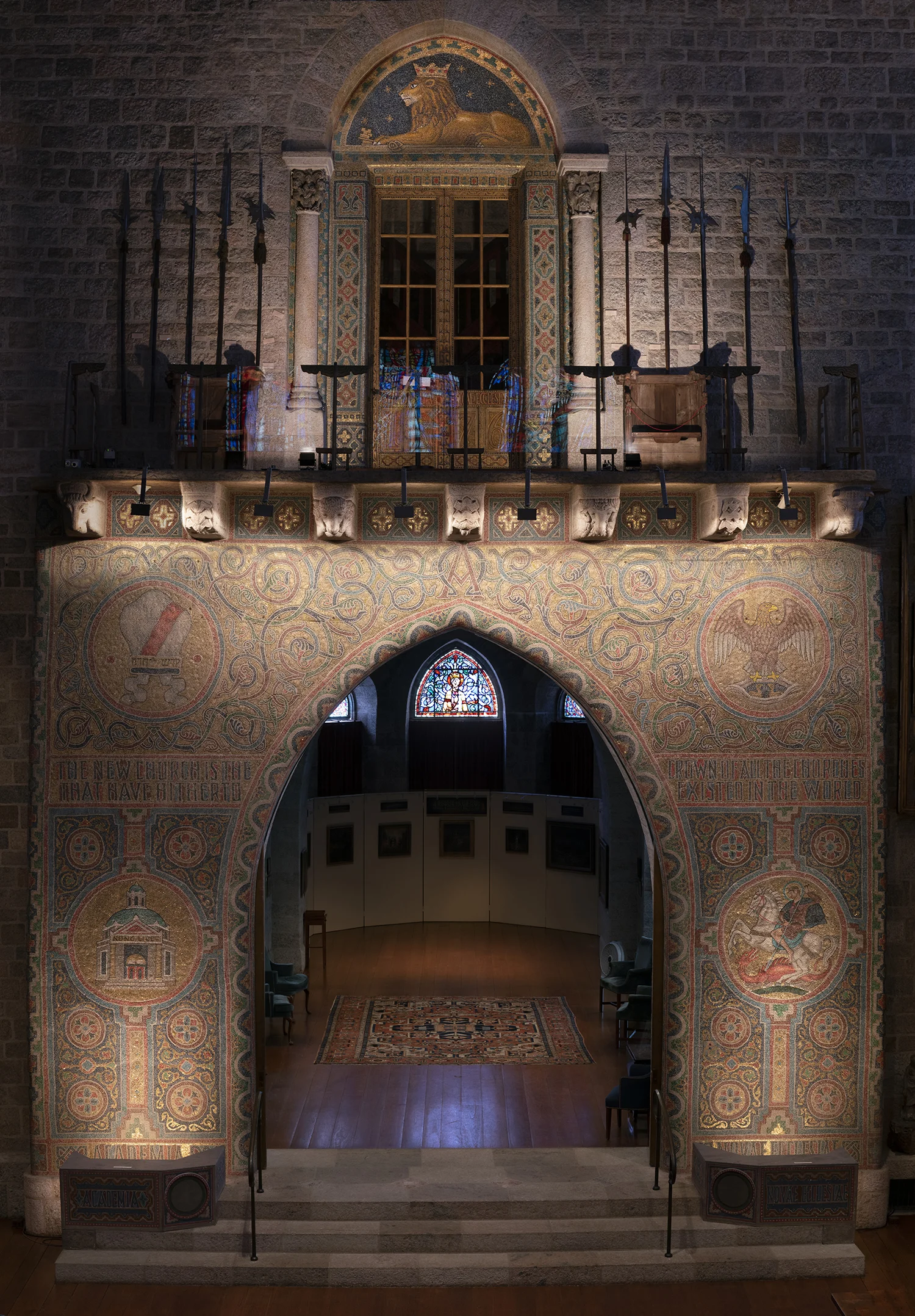 Figure 1: The Great Hall of Glencairn features a monumental version of the Academy seal in glass mosaic. It reaches above the third floor balcony, culminating in a representation of a crowned lion with keys beneath his paws.