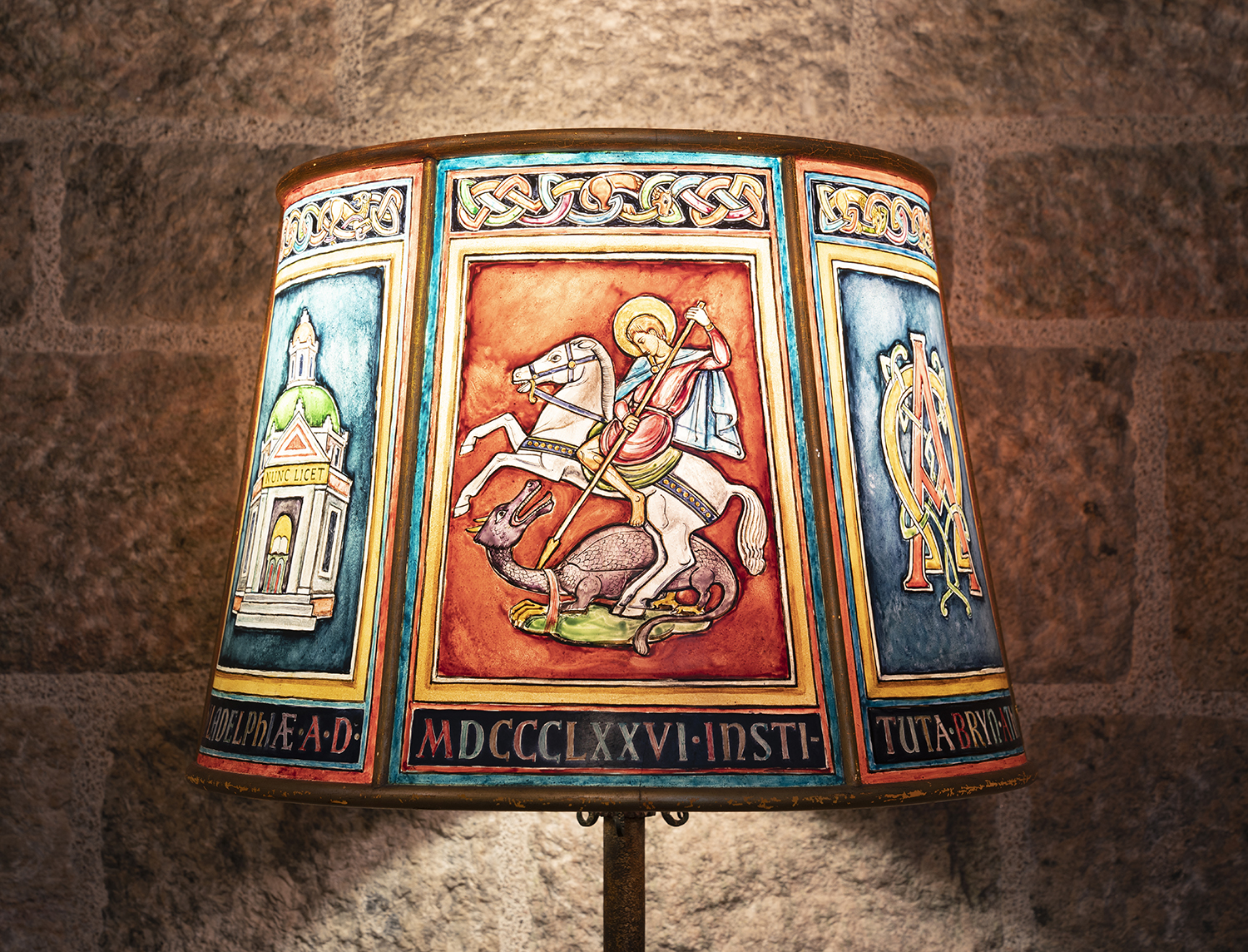 Figure 11: Artist Frank Snyder painted a six-sided Plexiglas lamp shade with the various elements of the Academy seal for Glencairn’s Chapel.