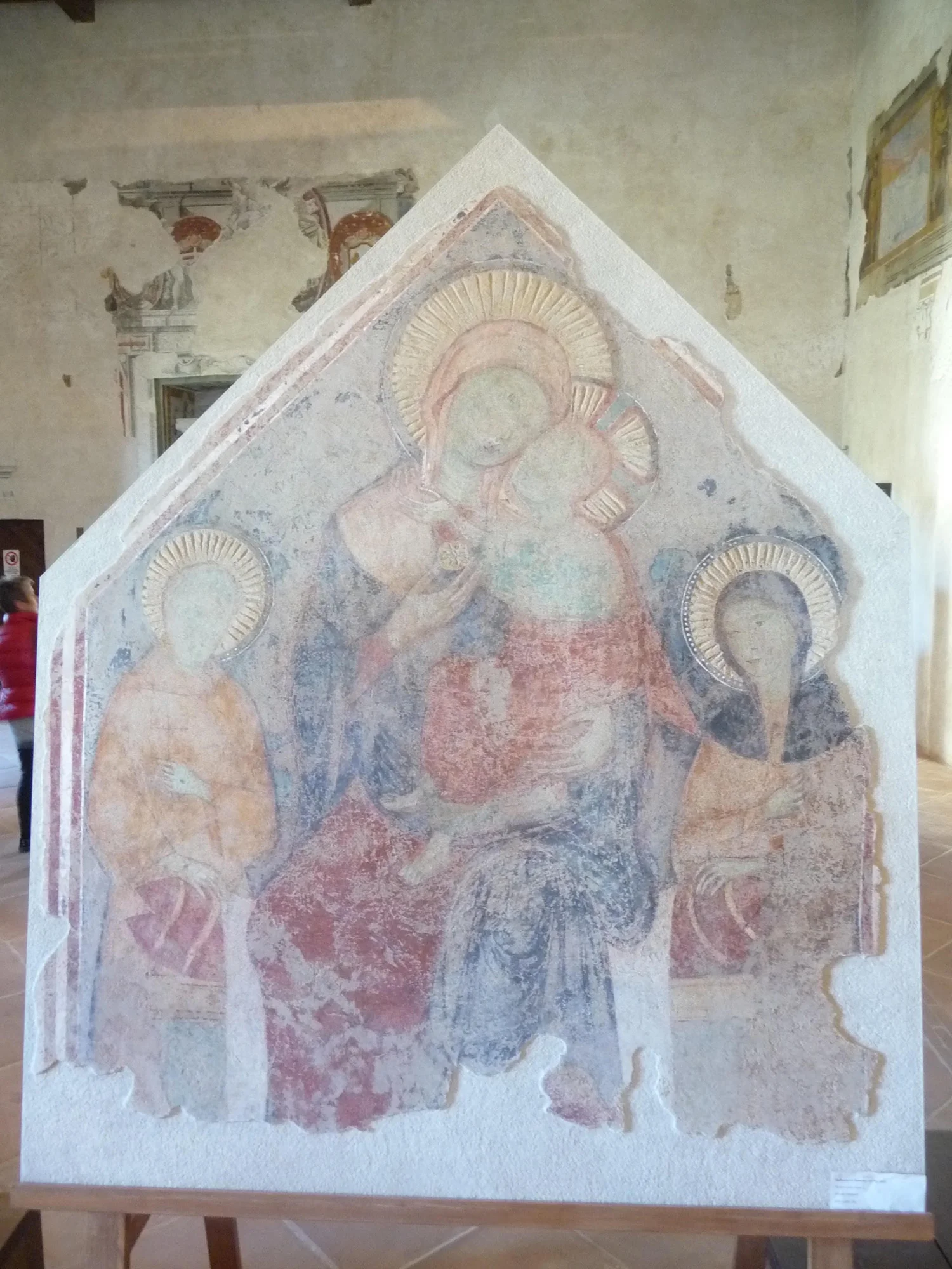 Figure 10. Madonna and Child with Saints Francis and Claire , detached fresco by an unknown artist, c. 1300, originally from the Clarissan monastery of Santa Maria inter Angelos, near Spoleto, Italy. Now in the Museo Nazionale del Ducato, Spoleto. Photograph by Jonathan Kline.