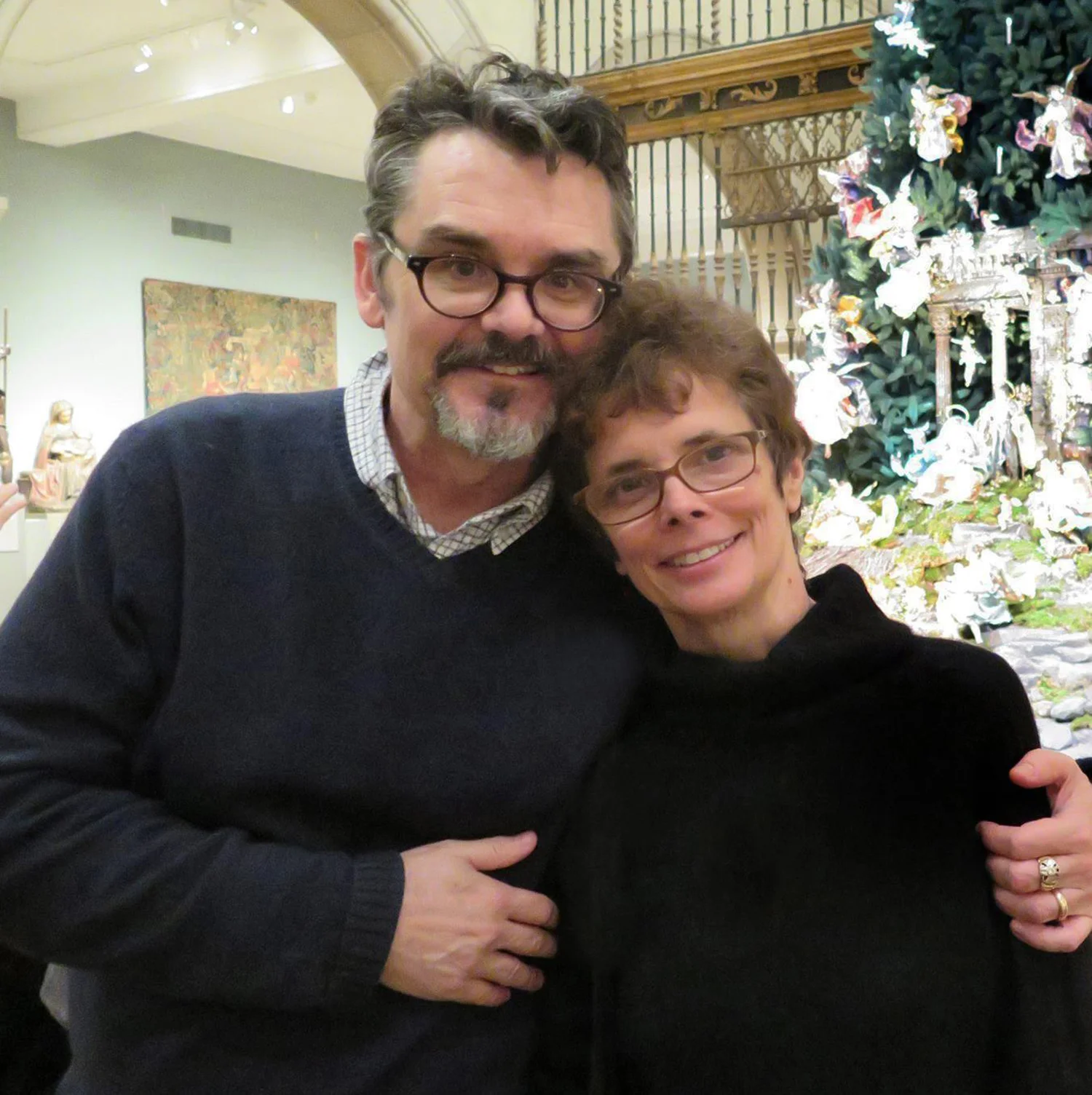 Figure 2: R. Michael Palan and Karen Loccisano pose by the Christmas tree and eighteenth-century Neapolitan Nativity scene at the Metropolitan Museum of Art in New York City. Photo courtesy of R. Michael Palan.