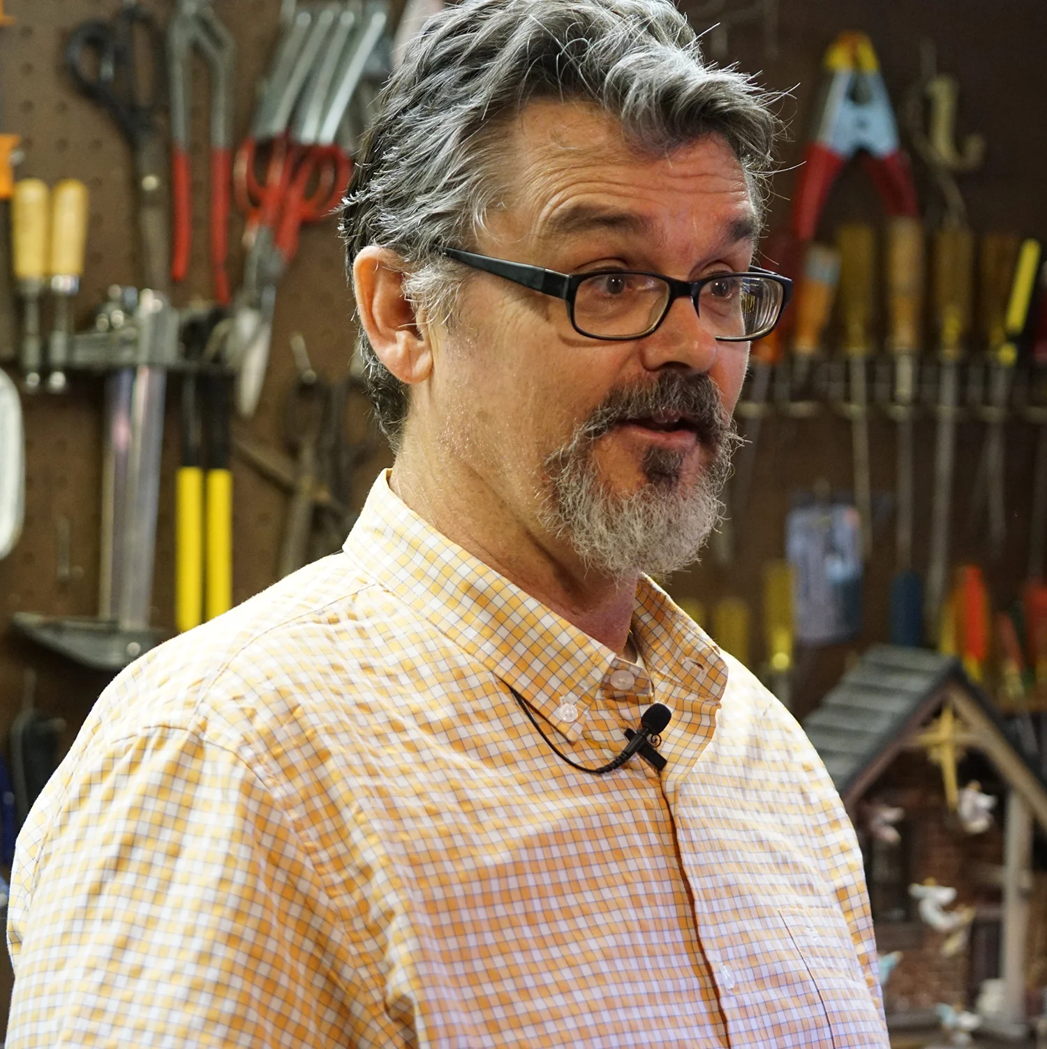 Figure 1: R. Michael Palan being interviewed in his basement workshop.