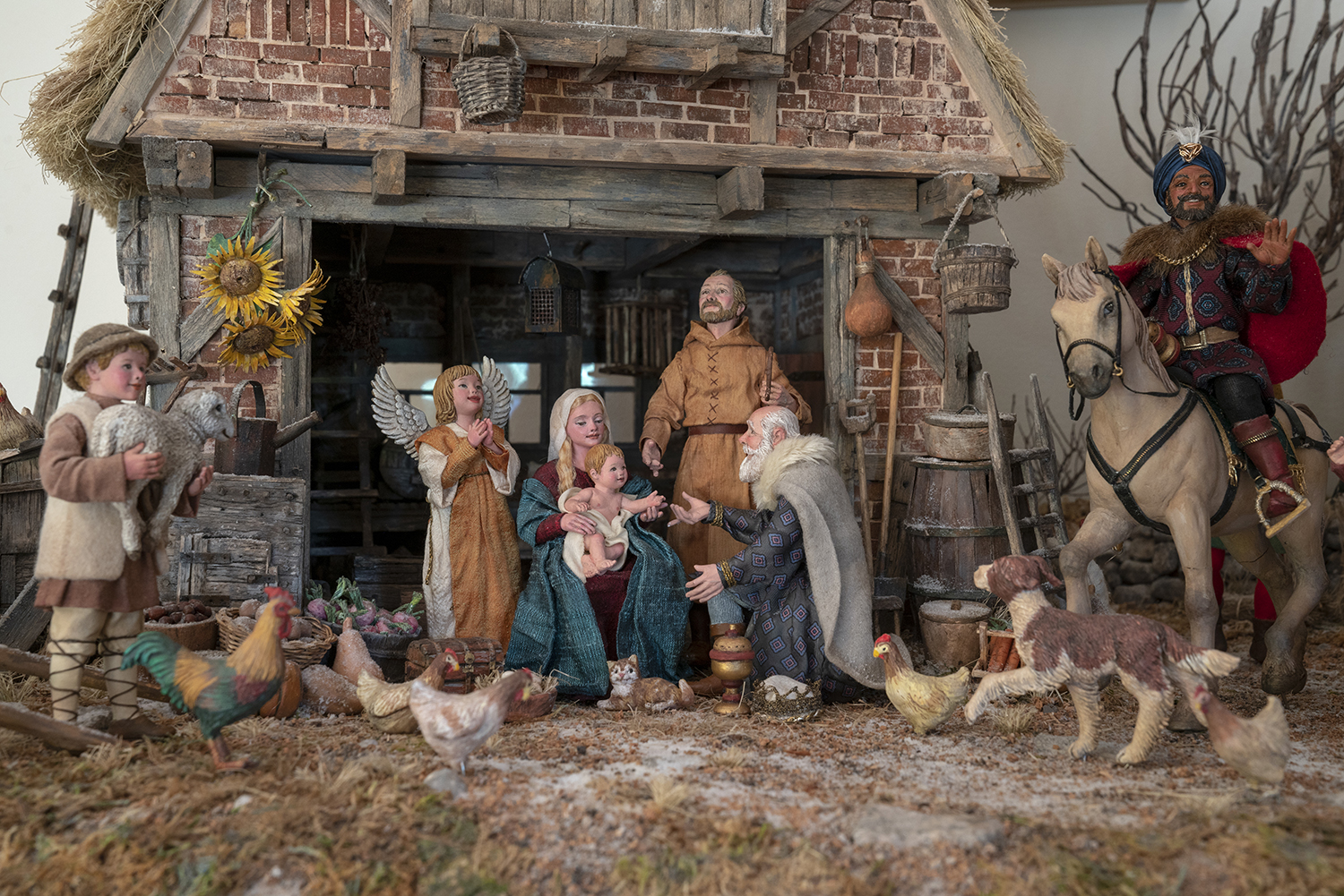 Figure 14: The Nativity of Jesus Christ depicted as taking place in a snowy, 16th-century Flemish village. R. Michael Palan and Karen Loccisano have included an angel with Down syndrome in this Nativity, standing near the Holy Family. Photo by R. Michael Palan.