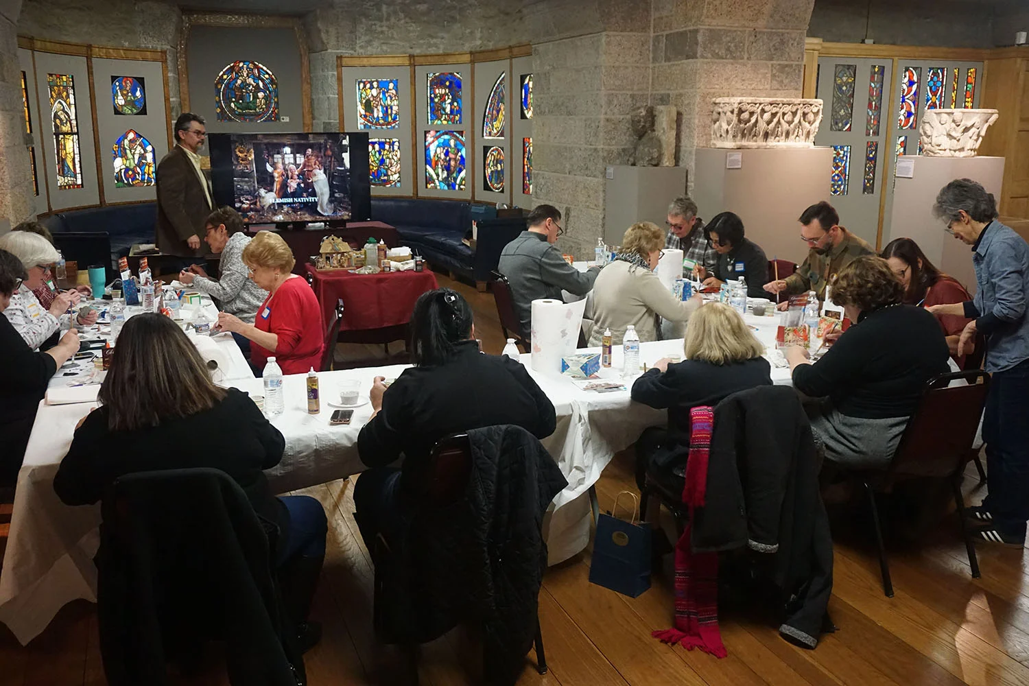 Figure 21: A workshop being led by R. Michael Palan and Karen Loccisano in Glencairn’s Medieval Gallery: “The Art of Making Nativities.”