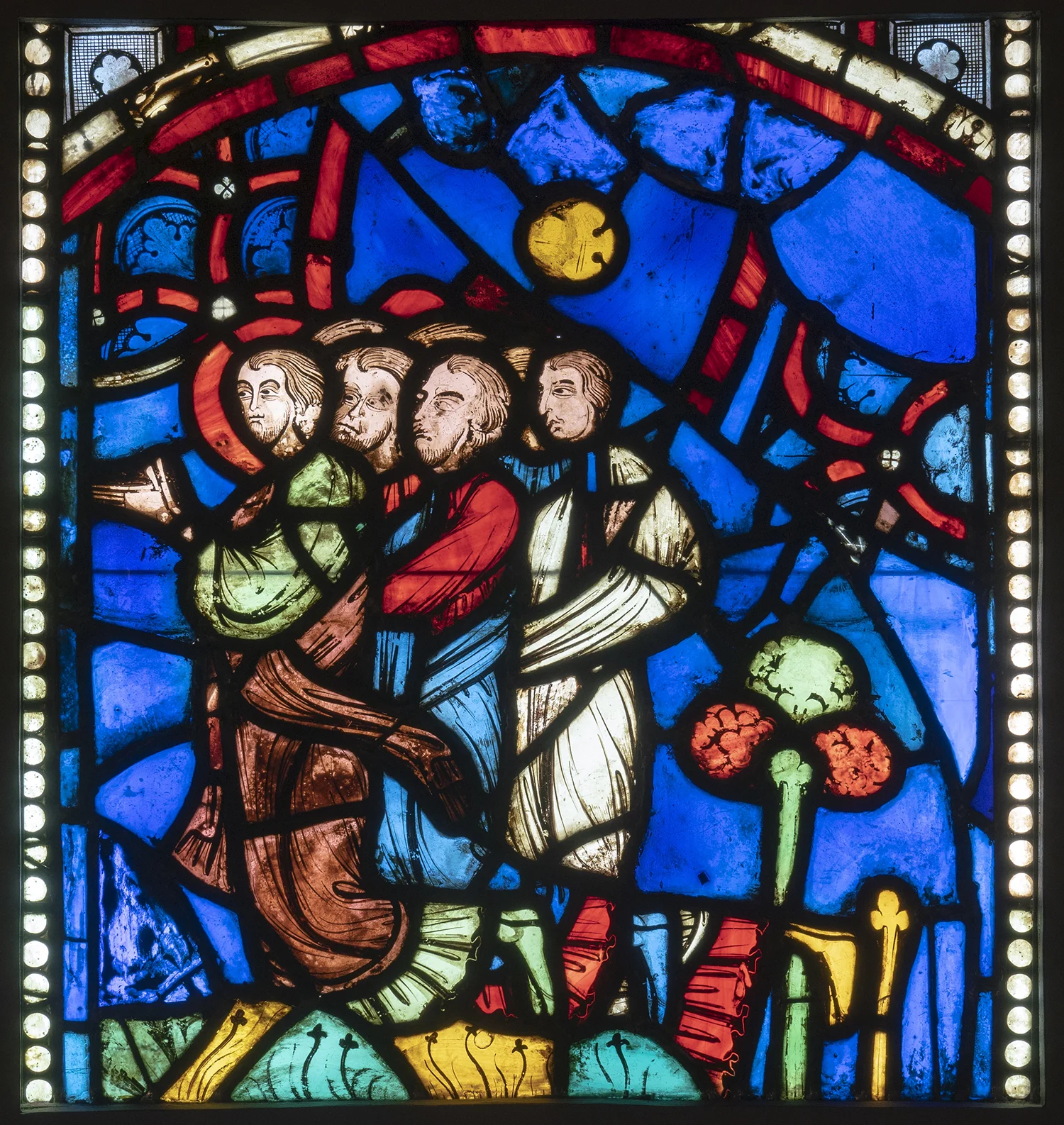 Figure 9: Seven Kneelers (probably apostles), from the John the Evangelist window of Rouen Cathedral, c. 1240-1245, now in Glencairn Museum (03.SG.52).