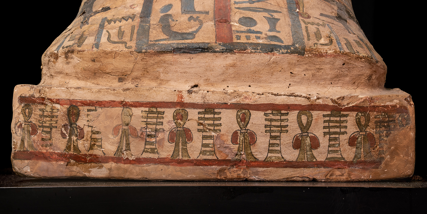 Figure 19: A frieze of alternating djed pillars (“stability”) and ankh s (“life”) decorate the small podium at the foot of the coffin lid.