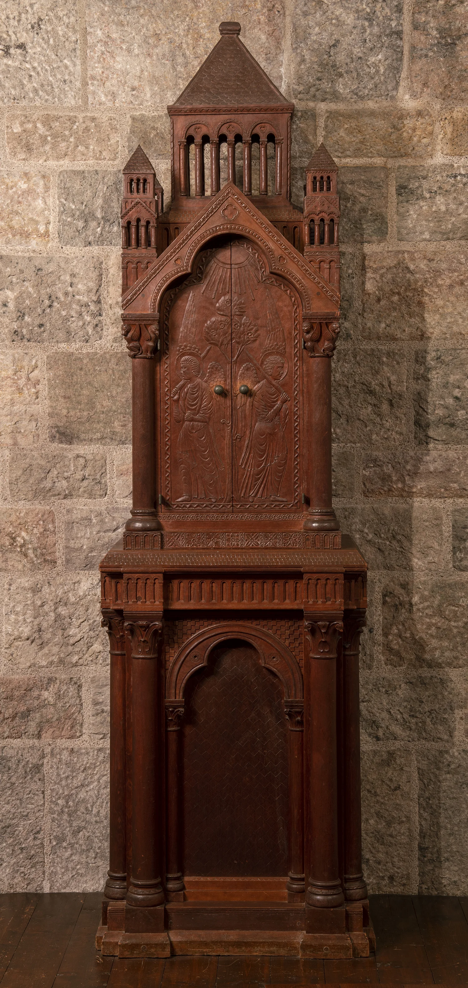 Figure 2: Raymond Pitcairn directed Frank Jeck to carve this Bible cabinet for use in the family’s chapel around the year 1926, before construction had begun on Glencairn. The biblical imagery on the cabinet is repeated elsewhere in the chapel in stone and glass mosaic.