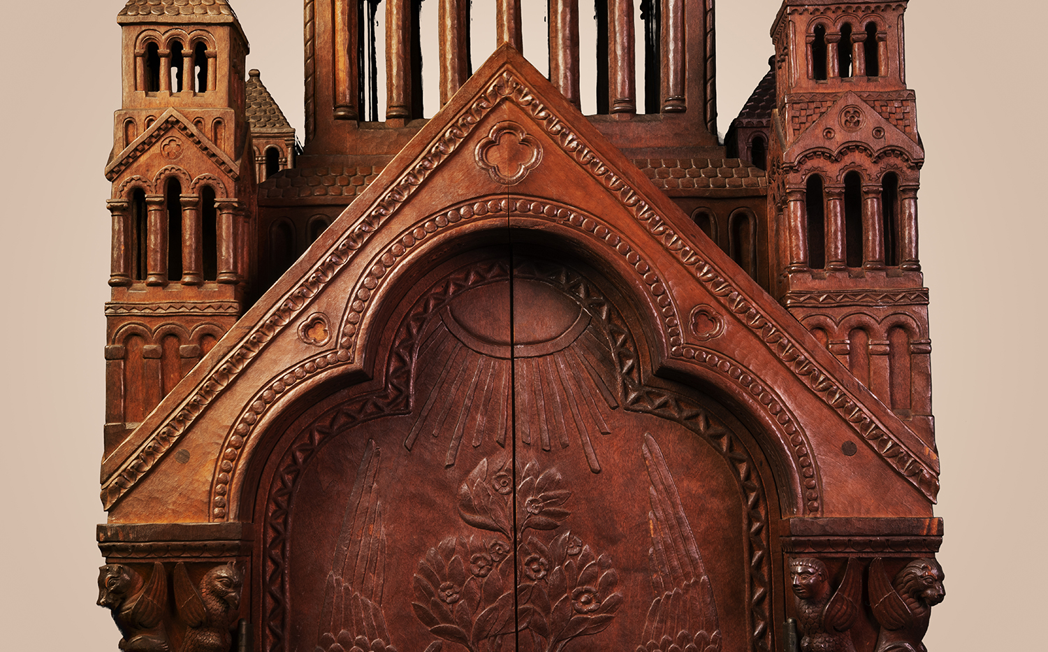 Figure 11: Above the doors of the Bible cabinet is a decorative feature Frank Jeck had used previously in a baby crib he made for Pitcairn (Figure 12): a peaked roofline combined with a trefoil arch (three interlocking rings) beneath it.