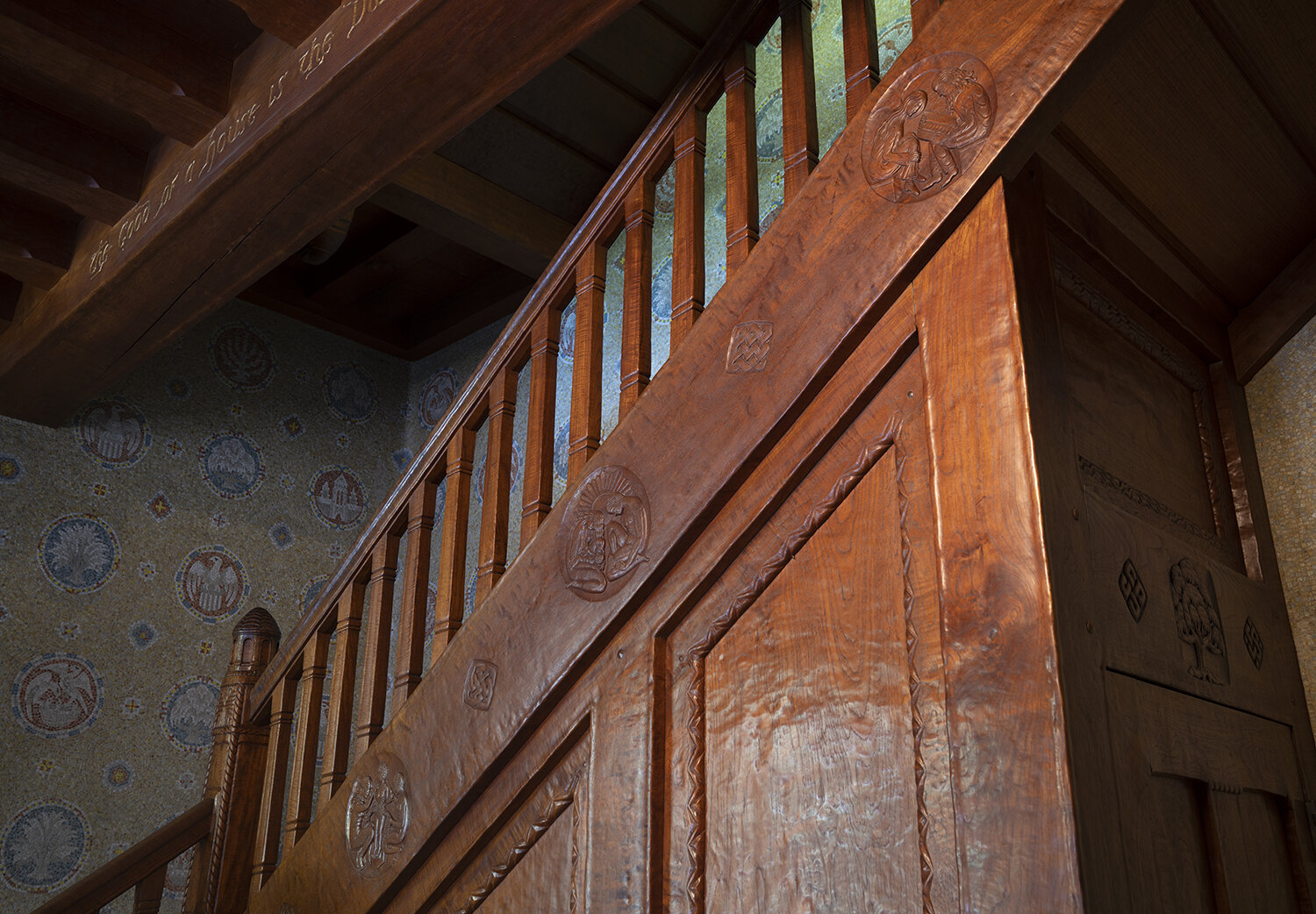 Figure 1: Frank Jeck carved a series of four teakwood medallions on the theme of the “Ages of Man” on Glencairn’s first floor staircase.