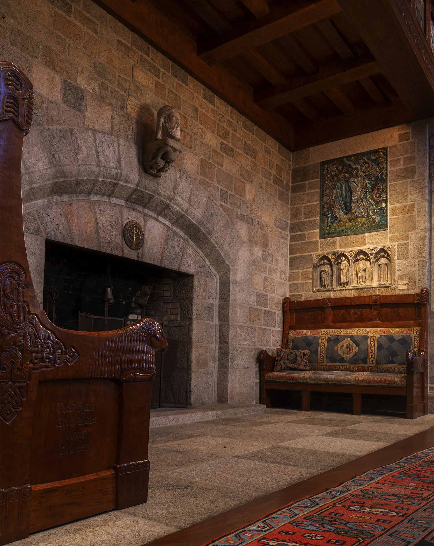 Figure 8: Two benches carved by Frank Jeck illustrating the uniting of Raymond and Mildred’s families through marriage were made for the inglenook in Glencairn’s Great Hall.