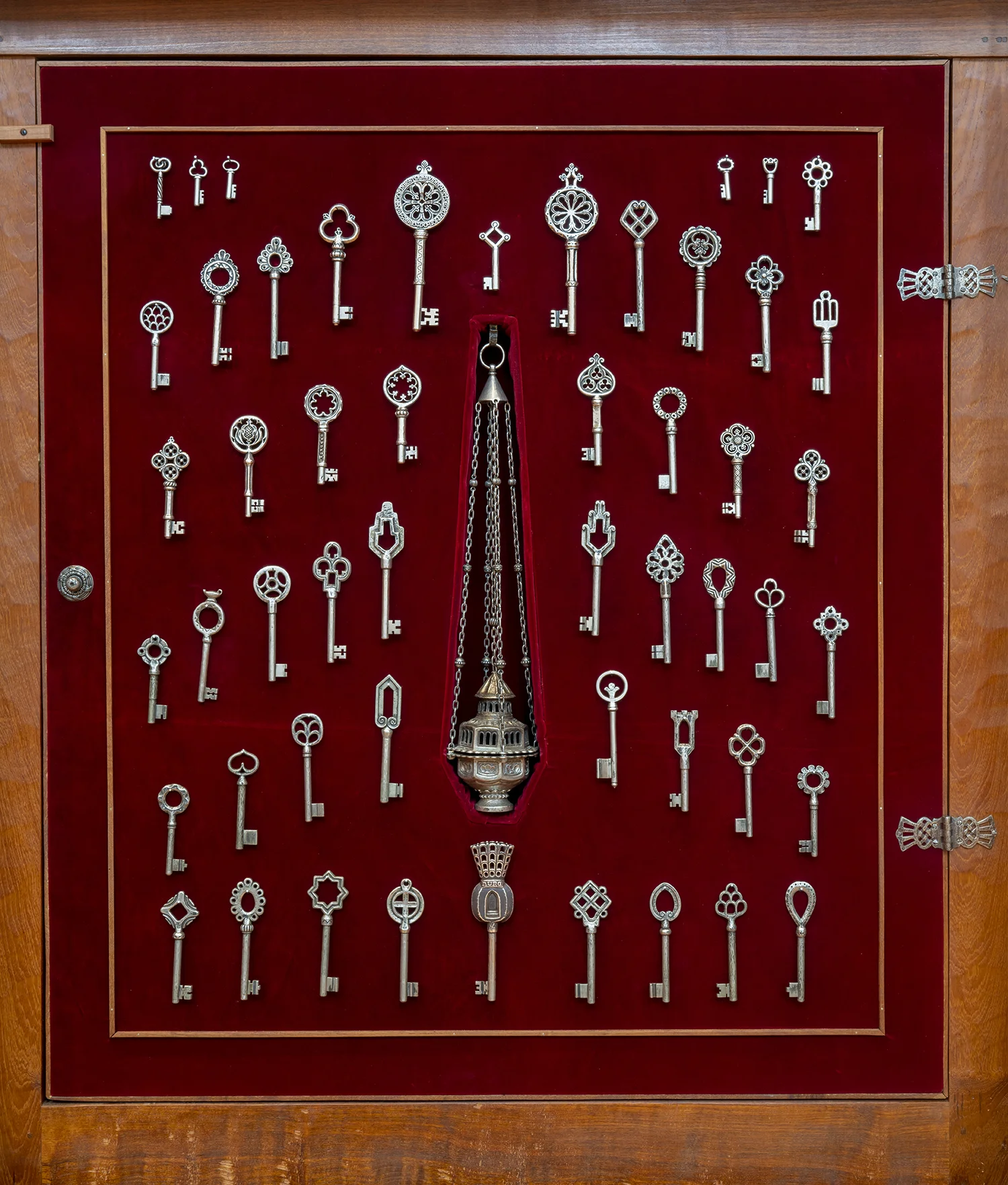Figure 5: The interior of the Cathedral’s key cabinet. The cabinet itself was carved by woodworker Jon Alley in the 1970s.